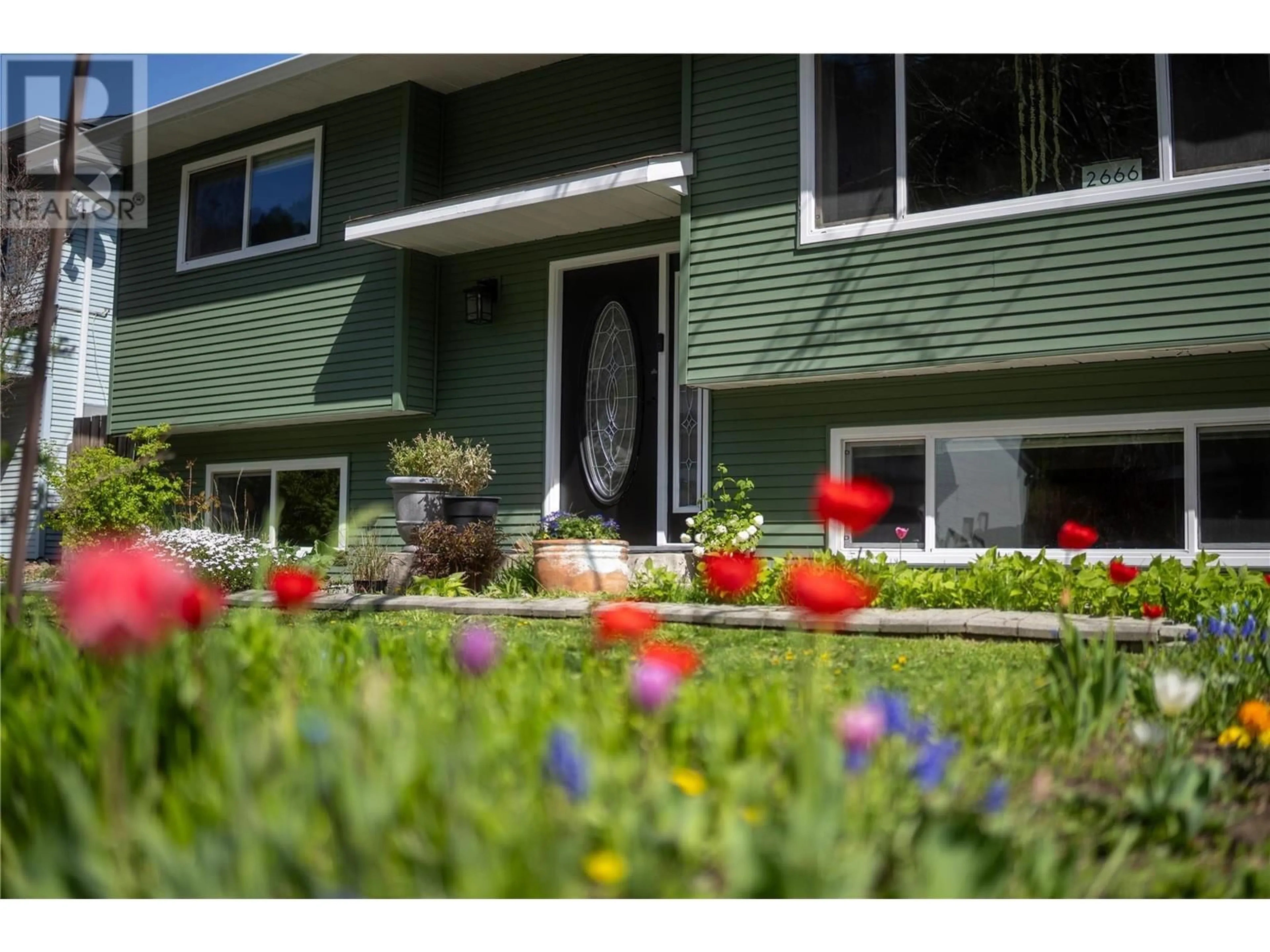Home with vinyl exterior material, street for 2666 QU'APPELLE BOULEVARD, Kamloops British Columbia V2E2H7
