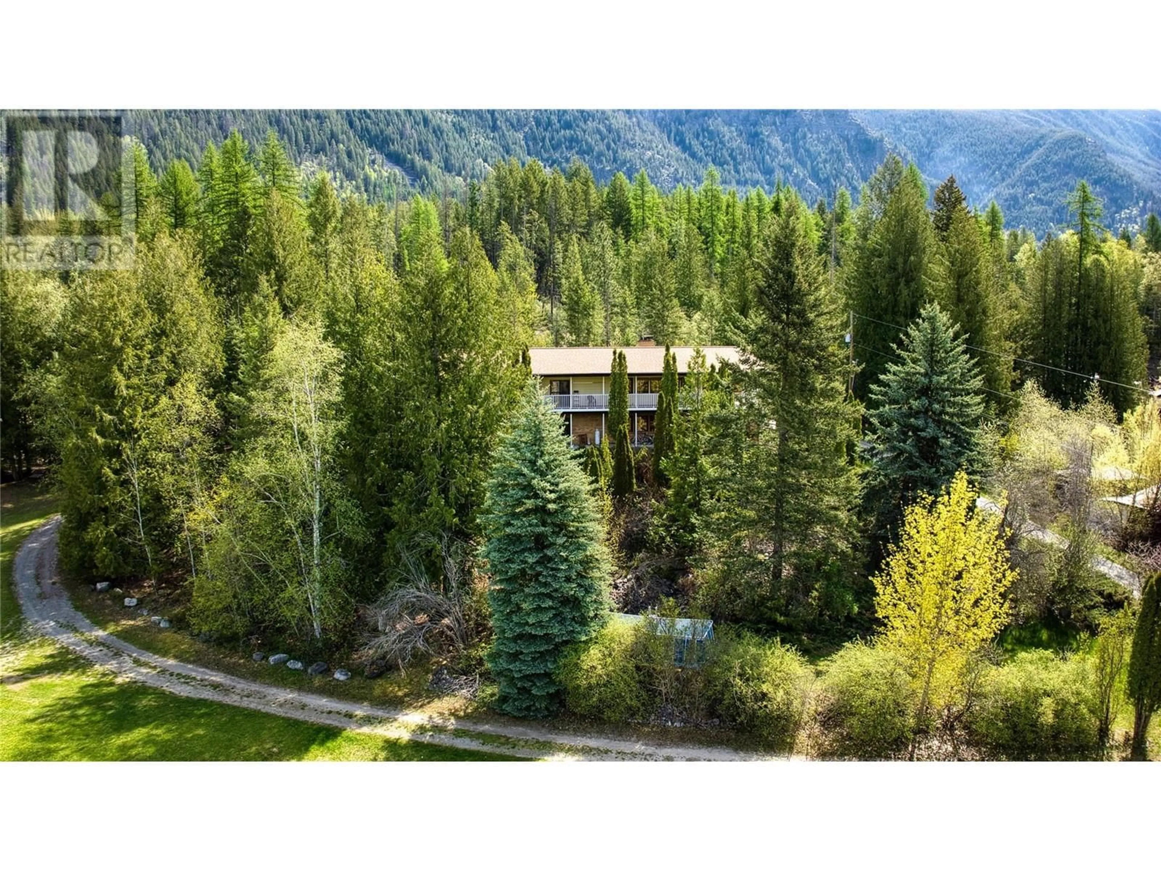 A pic from outside/outdoor area/front of a property/back of a property/a pic from drone, forest/trees view for 5110 VANCE ROAD, Creston British Columbia V0B1C1