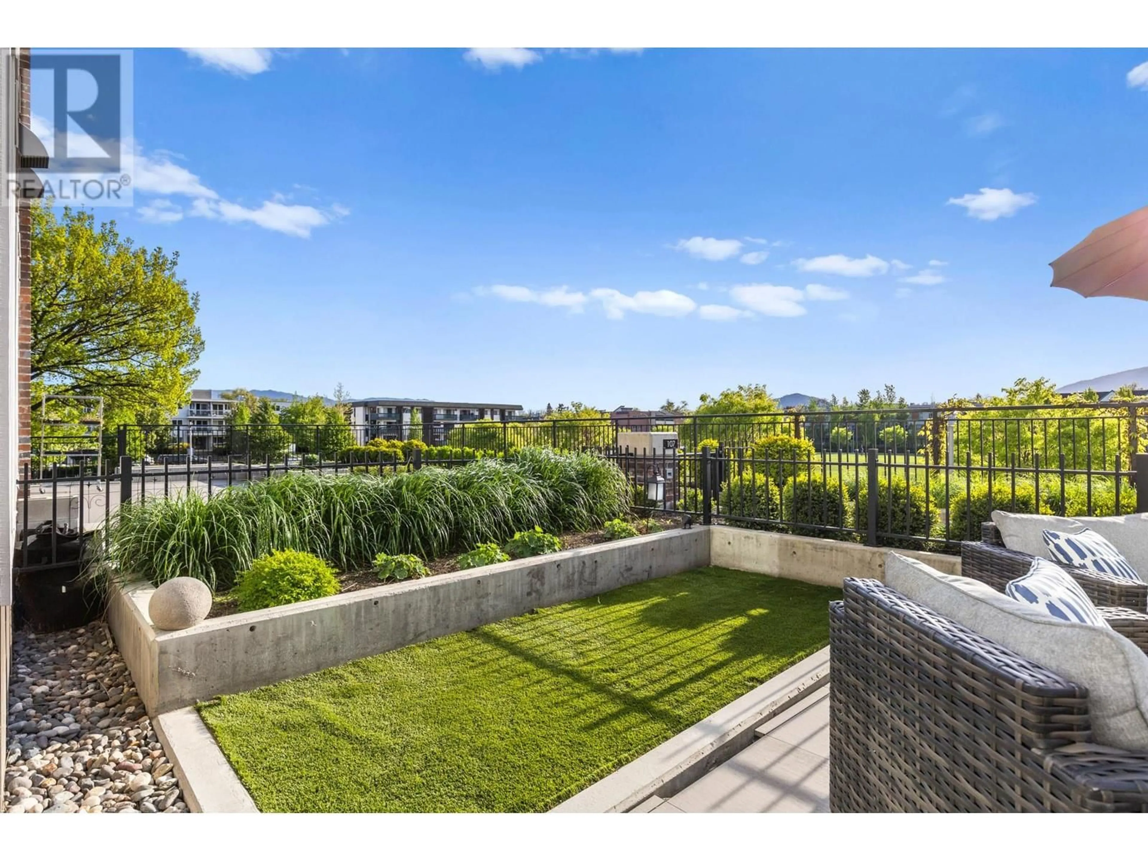 A pic from outside/outdoor area/front of a property/back of a property/a pic from drone, city buildings view from balcony for 108 - 1800 RICHTER STREET, Kelowna British Columbia V1Y2M6