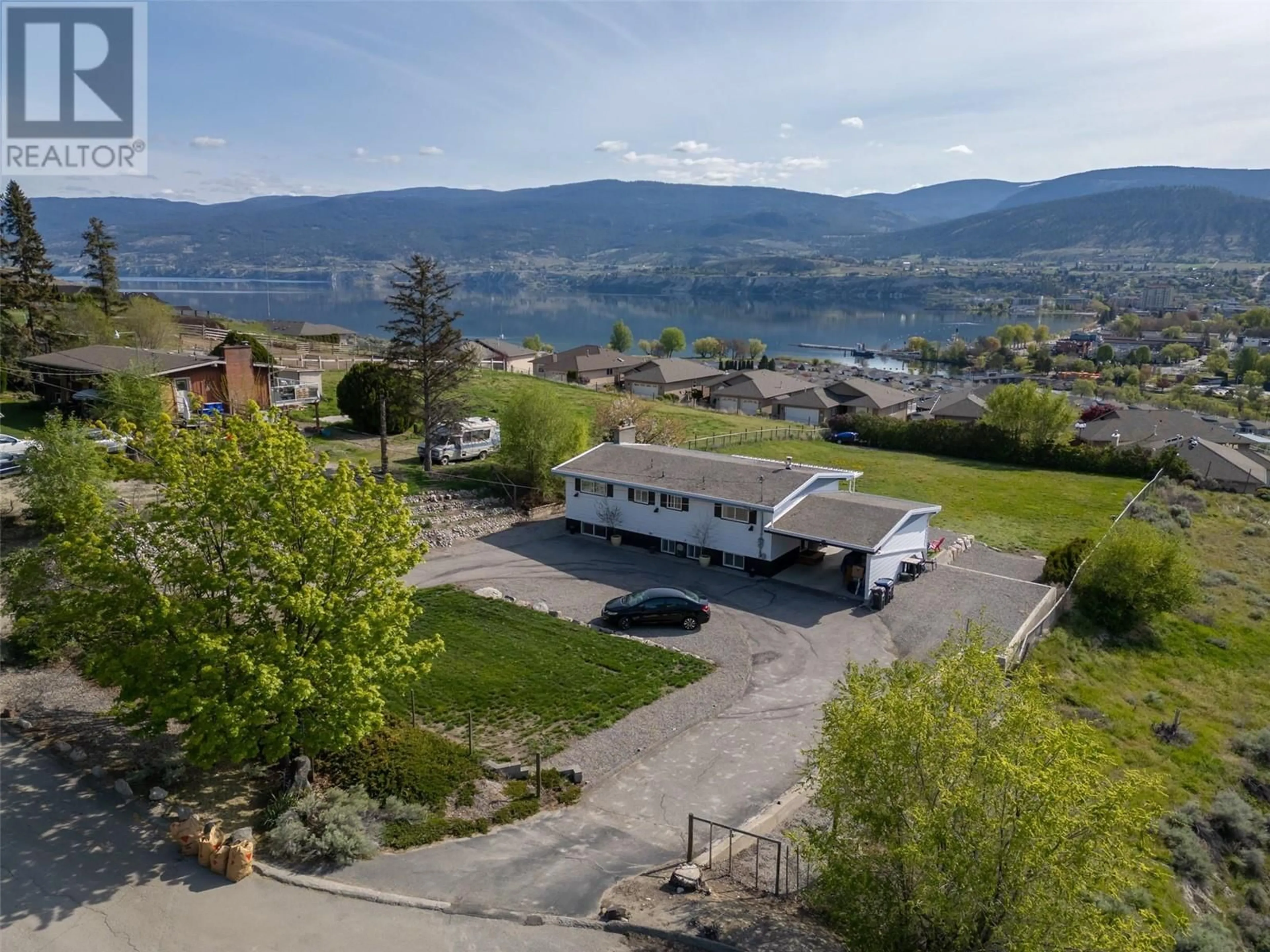 A pic from outside/outdoor area/front of a property/back of a property/a pic from drone, mountain view for 1407 SPARTON DRIVE, Penticton British Columbia V2A8Z5
