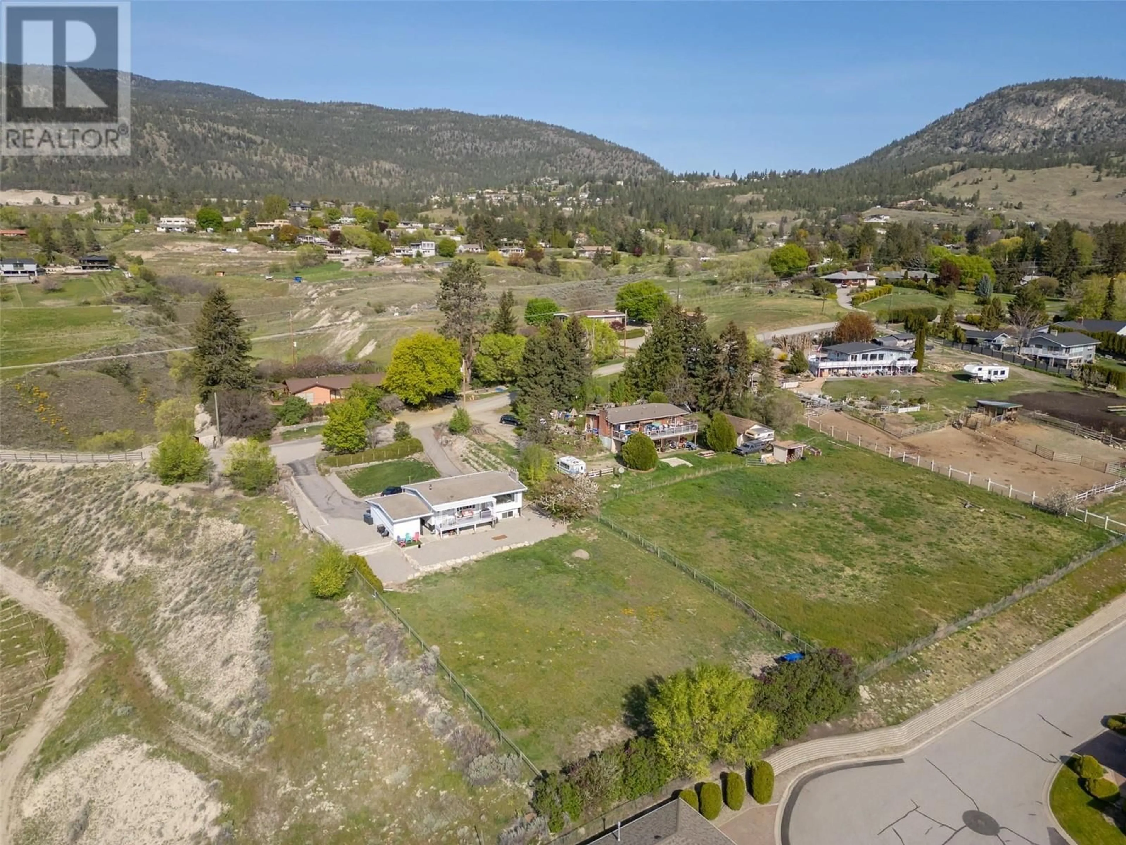 A pic from outside/outdoor area/front of a property/back of a property/a pic from drone, mountain view for 1407 SPARTON DRIVE, Penticton British Columbia V2A8Z5