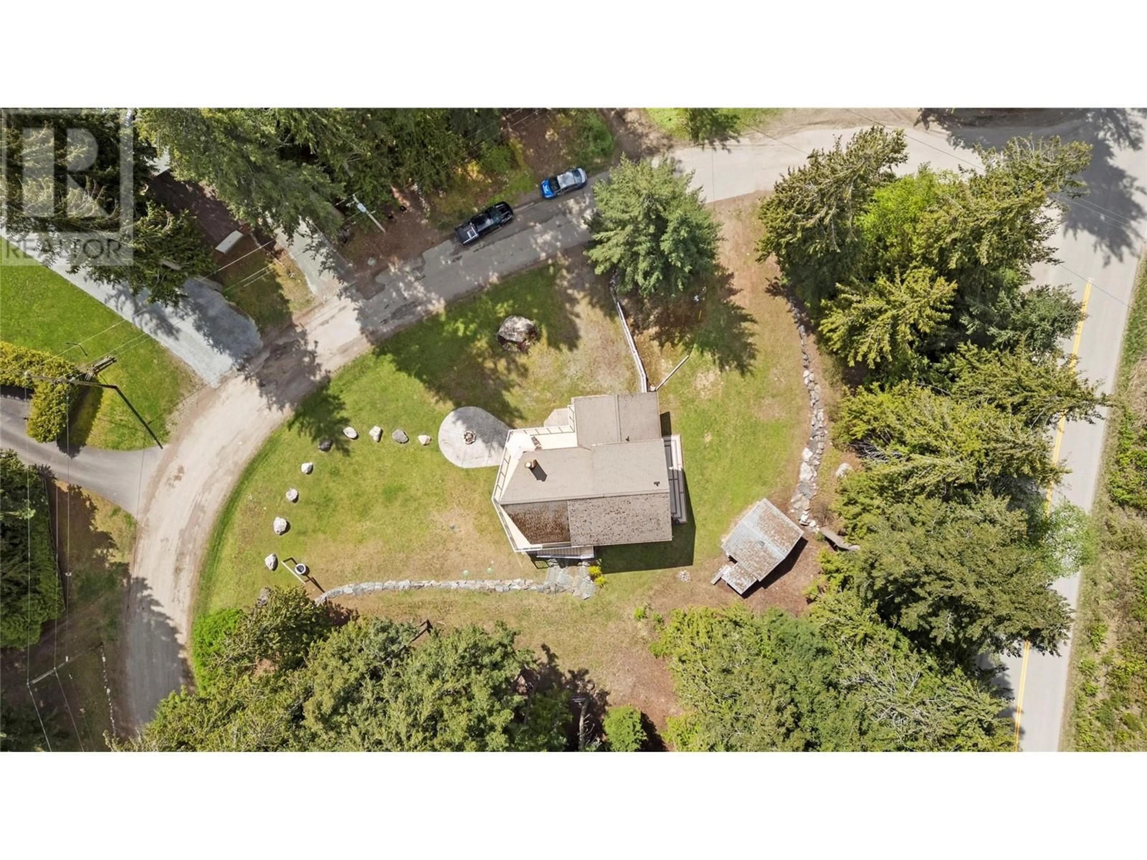 A pic from outside/outdoor area/front of a property/back of a property/a pic from drone, street for 7889 GARDINER ROAD, Anglemont British Columbia V0E1M8