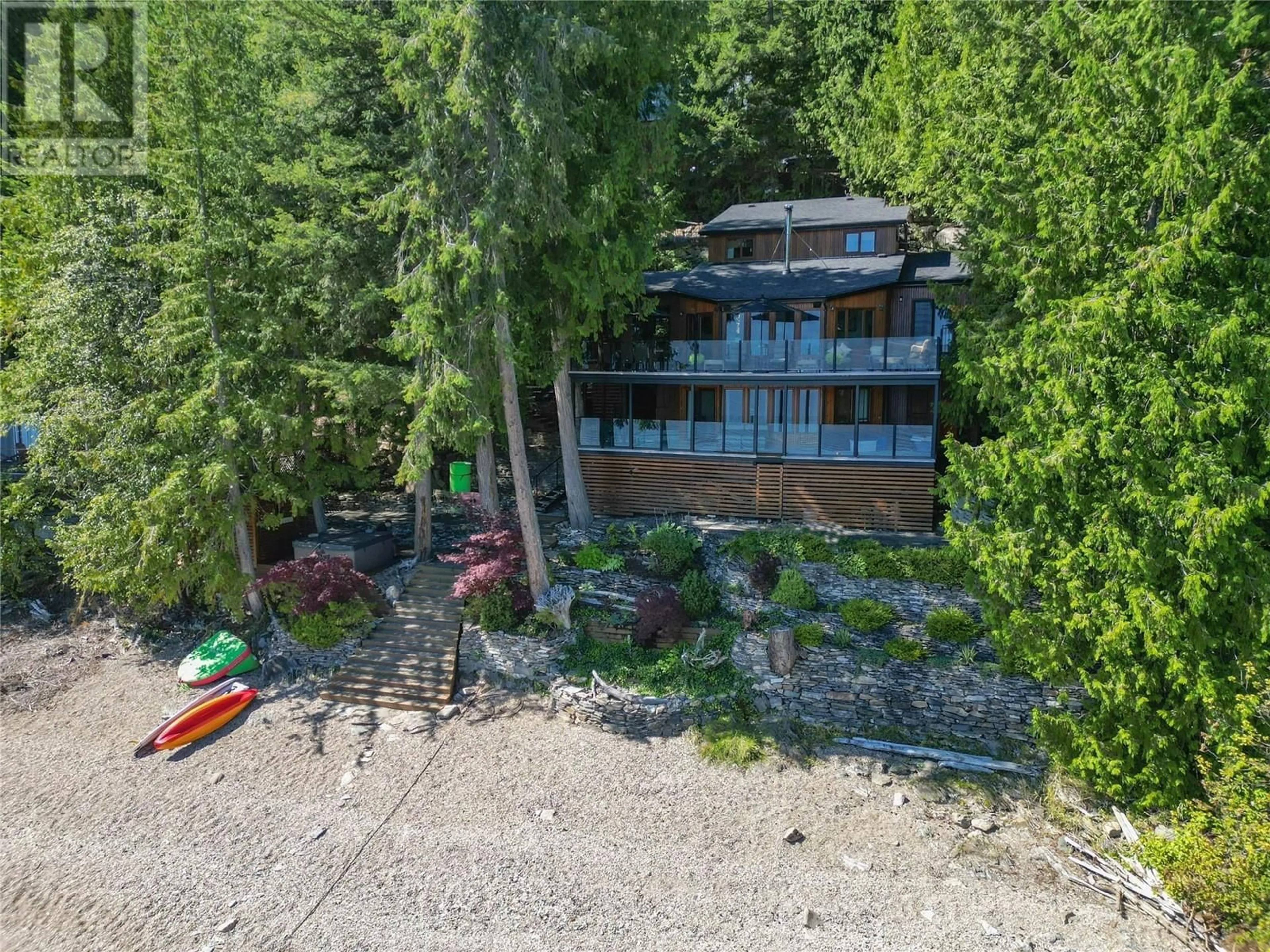 A pic from outside/outdoor area/front of a property/back of a property/a pic from drone, water/lake/river/ocean view for 7302 SUNNYBRAE CANOE POINT ROAD, Tappen British Columbia V0E2X1