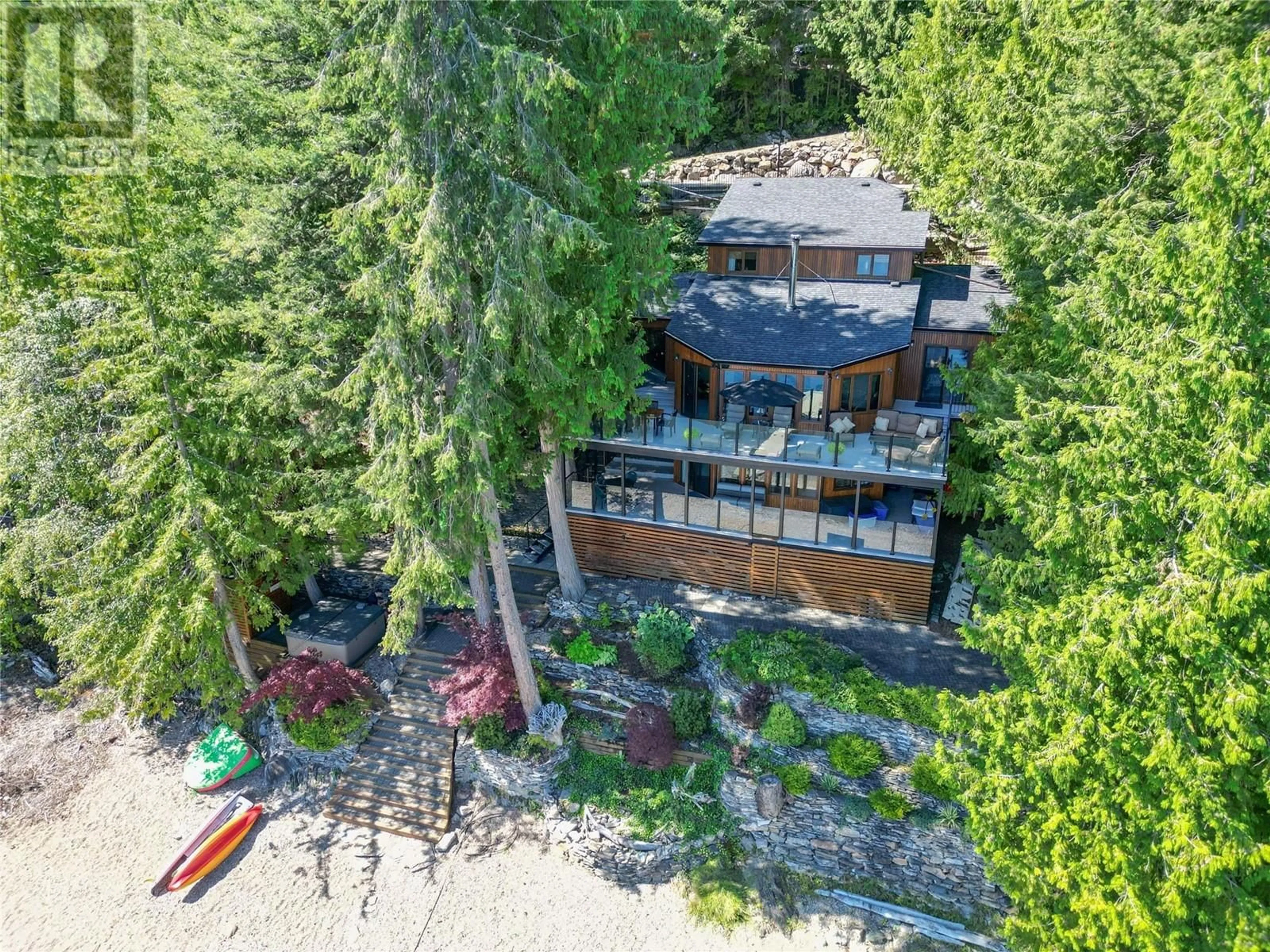 A pic from outside/outdoor area/front of a property/back of a property/a pic from drone, water/lake/river/ocean view for 7302 SUNNYBRAE CANOE POINT ROAD, Tappen British Columbia V0E2X1
