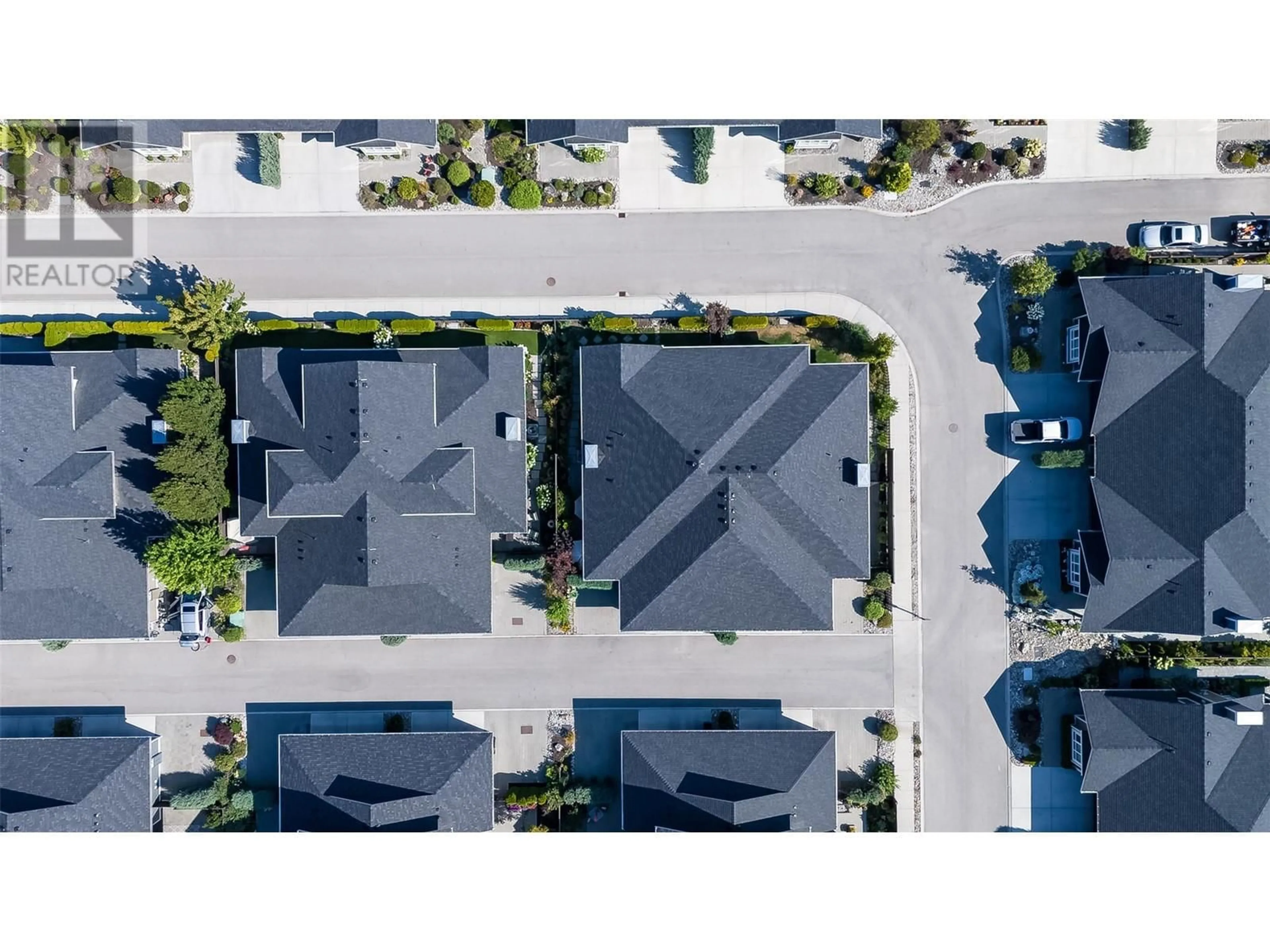 A pic from outside/outdoor area/front of a property/back of a property/a pic from drone, street for 47 - 1960 KLO ROAD, Kelowna British Columbia V1W5L2