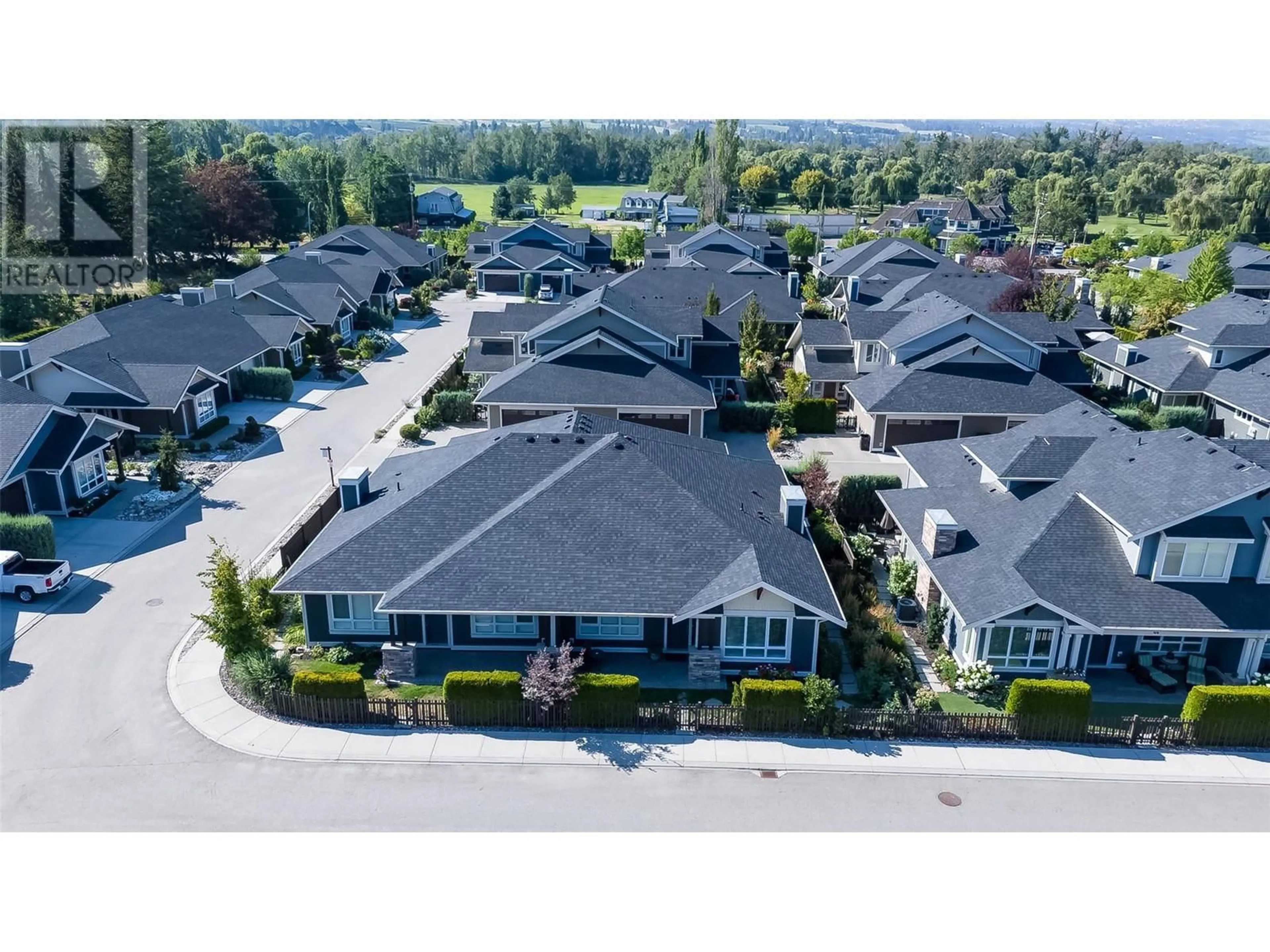A pic from outside/outdoor area/front of a property/back of a property/a pic from drone, street for 47 - 1960 KLO ROAD, Kelowna British Columbia V1W5L2