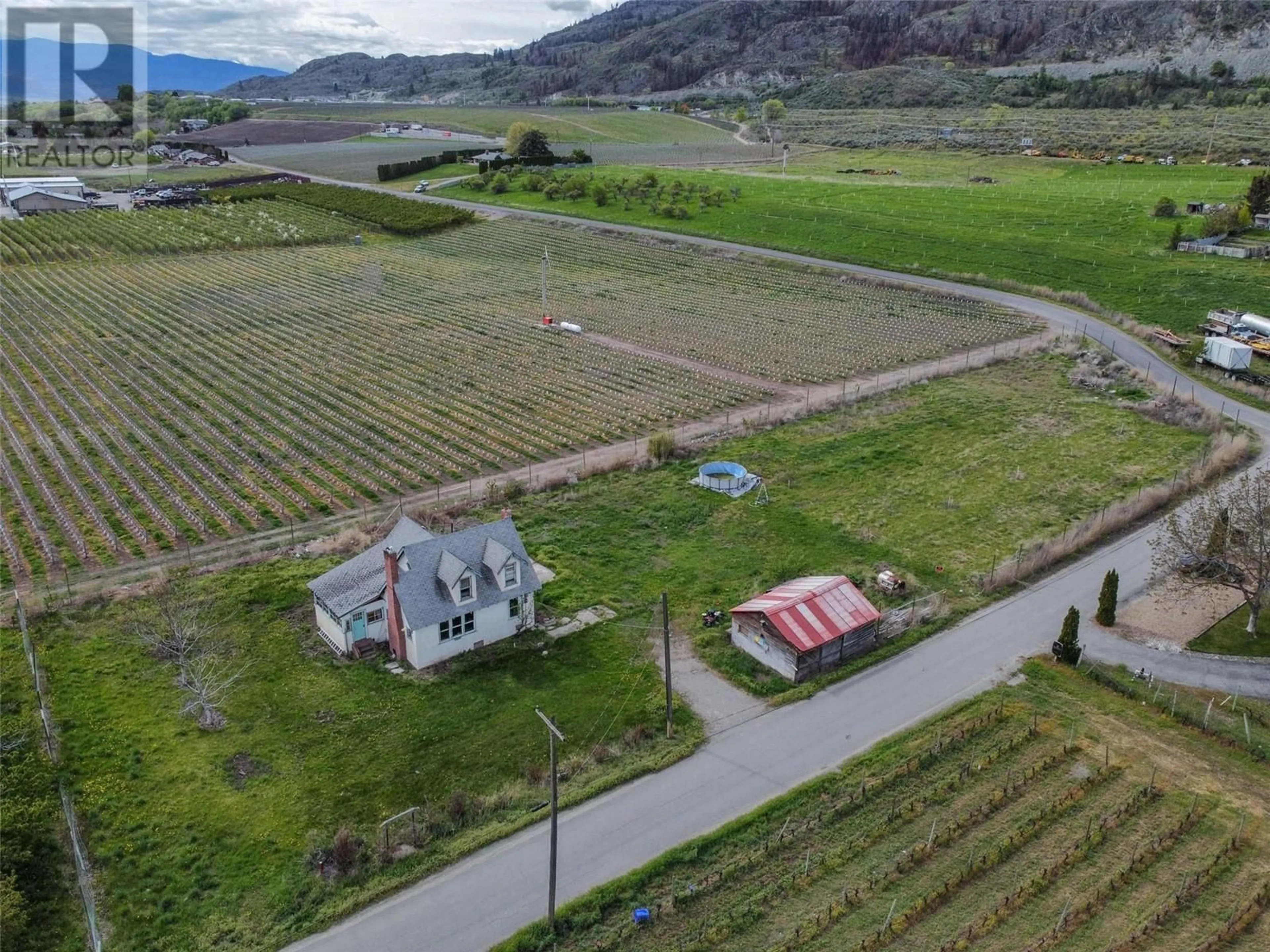 A pic from outside/outdoor area/front of a property/back of a property/a pic from drone, mountain view for 9723 160TH AVENUE, Osoyoos British Columbia V0H1V0