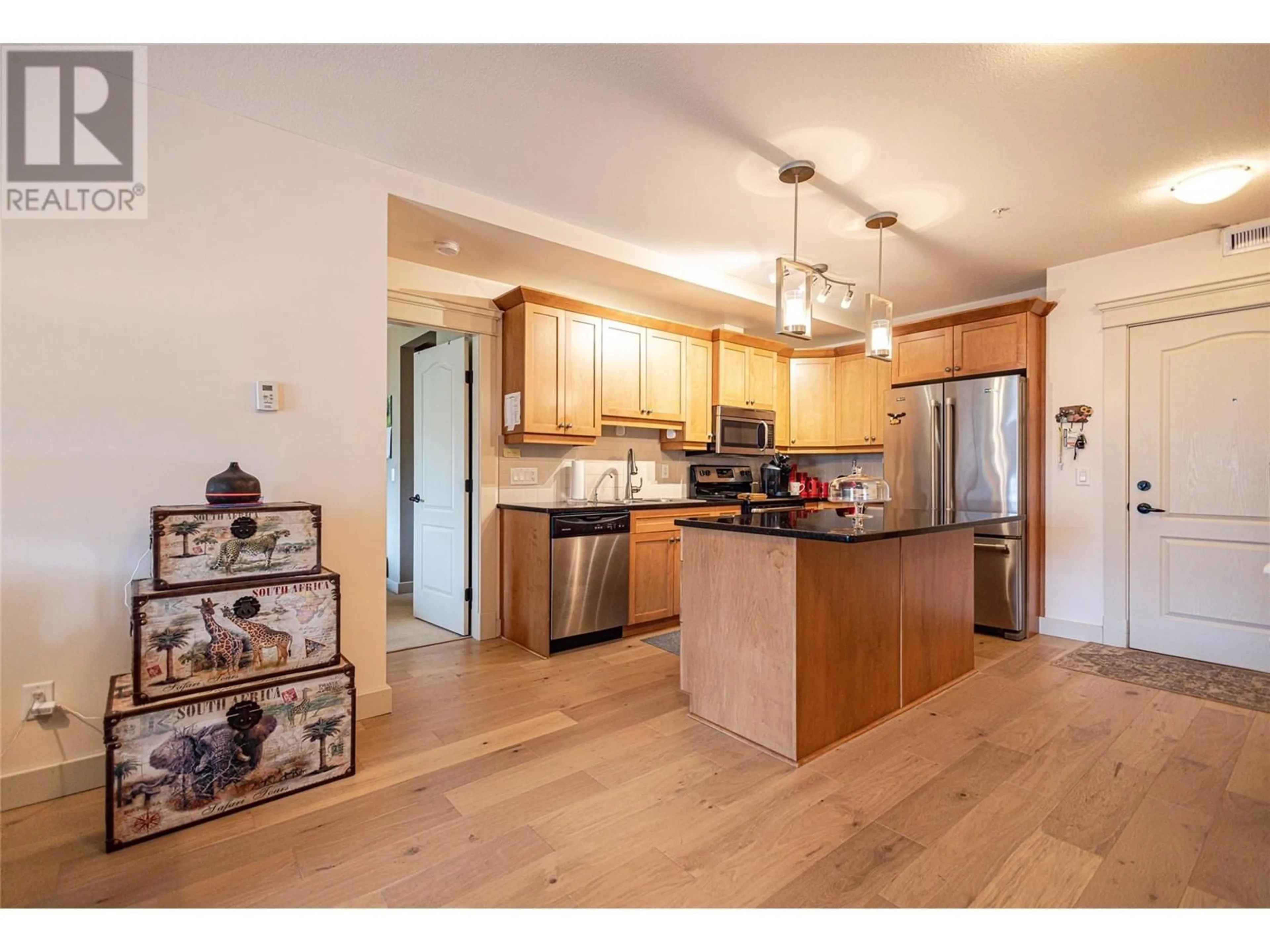 Open concept kitchen, wood/laminate floor for 312 - 2070 BOUCHERIE ROAD, West Kelowna British Columbia V4T3K9