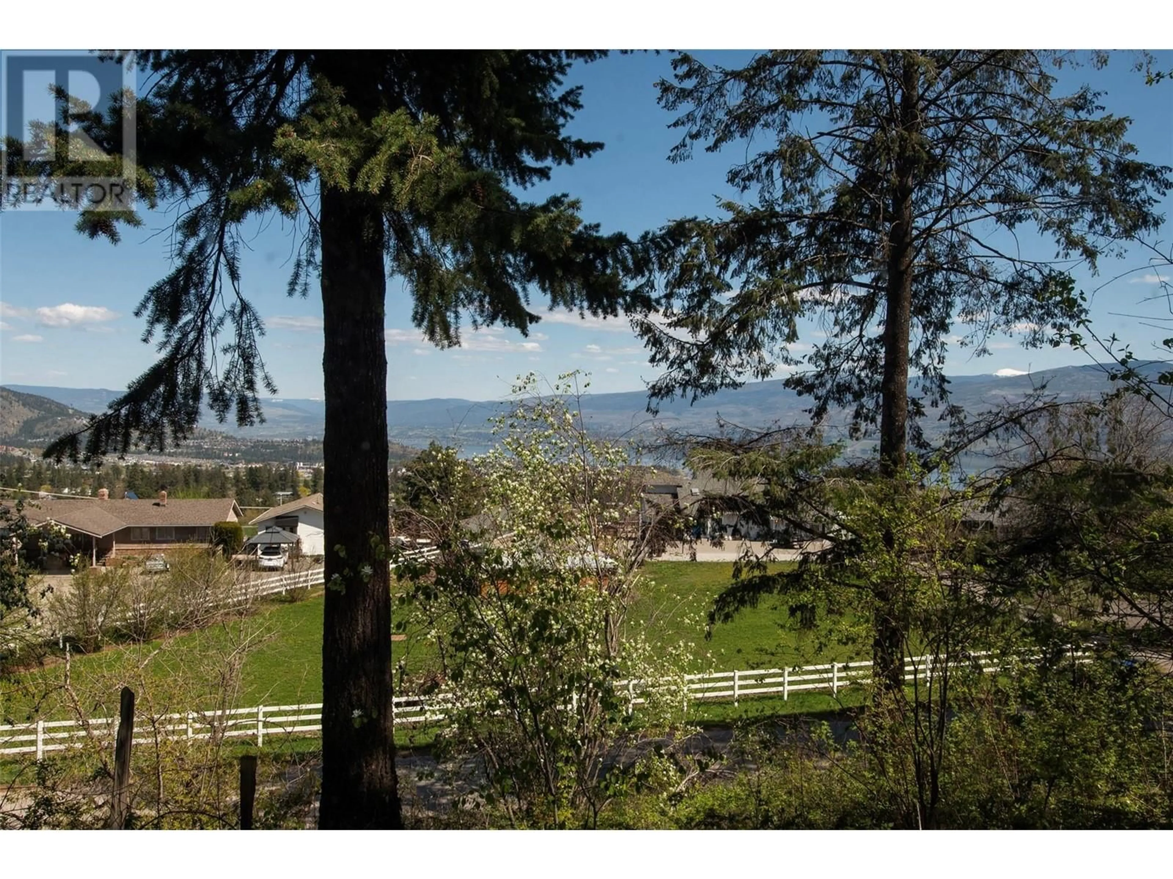 A pic from outside/outdoor area/front of a property/back of a property/a pic from drone, unknown for 3021 MCIVER ROAD, West Kelowna British Columbia V4T1C4