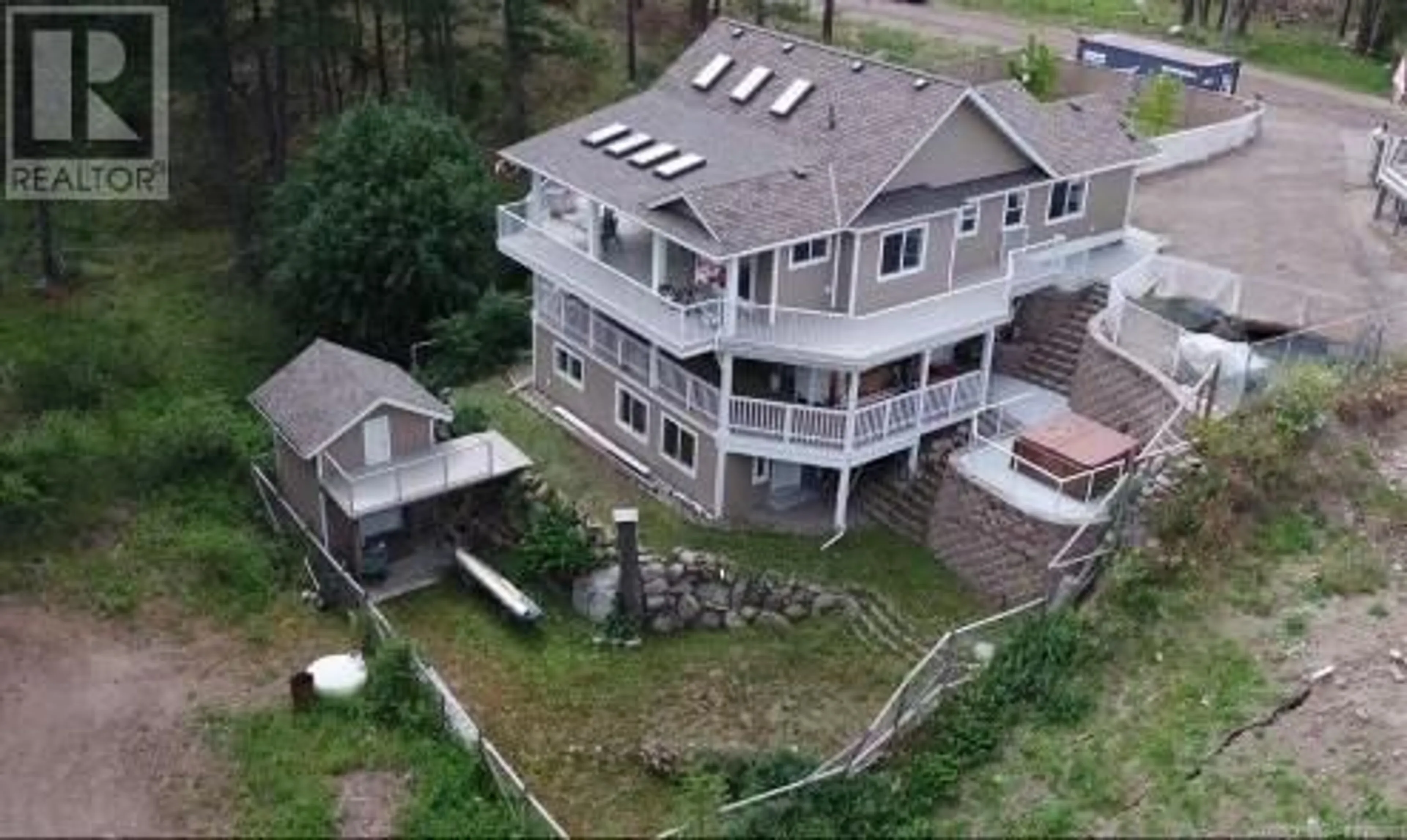 A pic from outside/outdoor area/front of a property/back of a property/a pic from drone, mountain view for 674 MUIR ROAD, Kelowna British Columbia V1Z3W2
