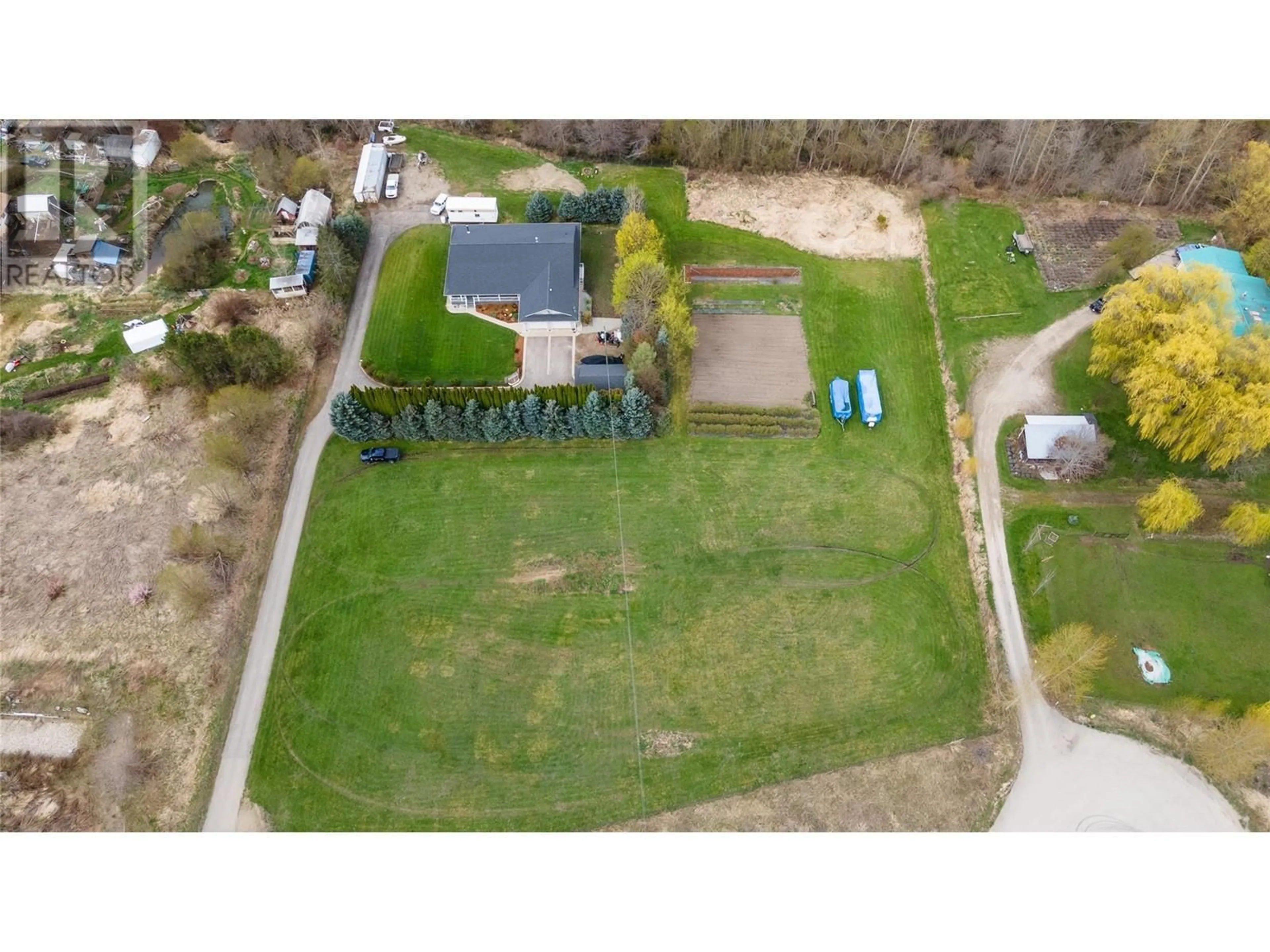 A pic from outside/outdoor area/front of a property/back of a property/a pic from drone, street for 2201 50TH STREET, Salmon Arm British Columbia V1E1Y4