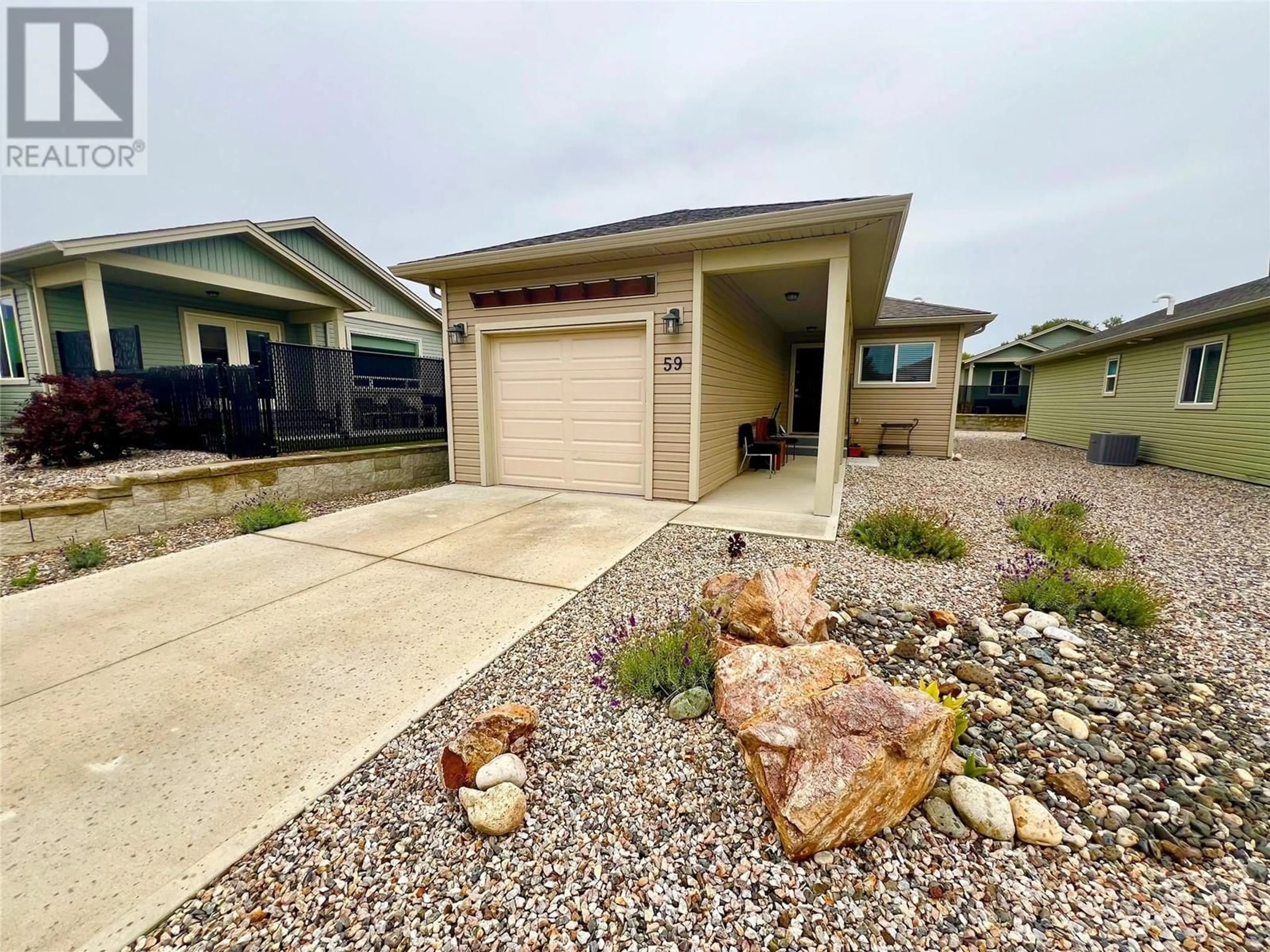 A pic from outside/outdoor area/front of a property/back of a property/a pic from drone, street for 59 - 2100 55 AVENUE, Vernon British Columbia V1T9Y6