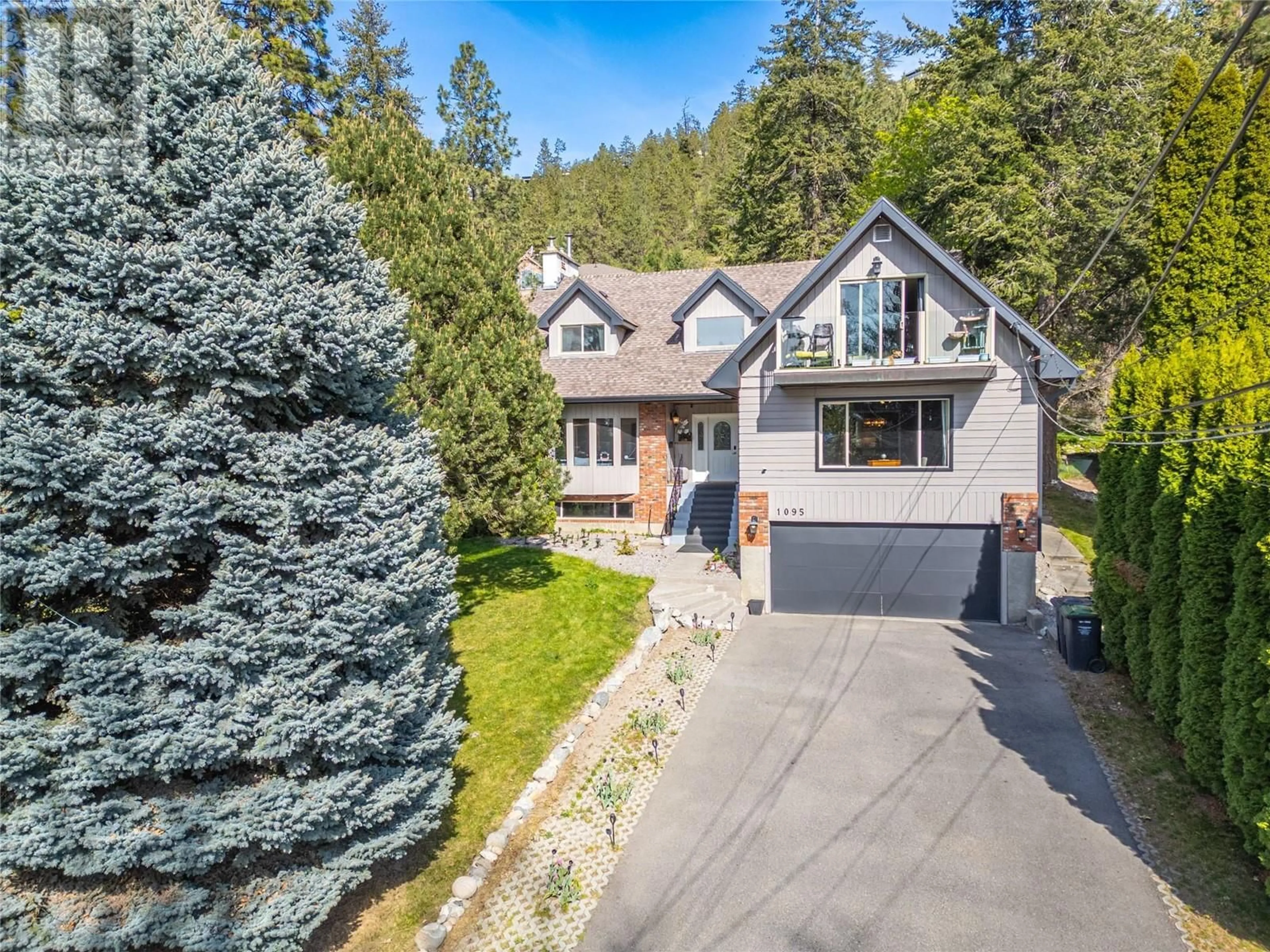 A pic from outside/outdoor area/front of a property/back of a property/a pic from drone, street for 1095 TOOVEY ROAD, Kelowna British Columbia V1X6R2