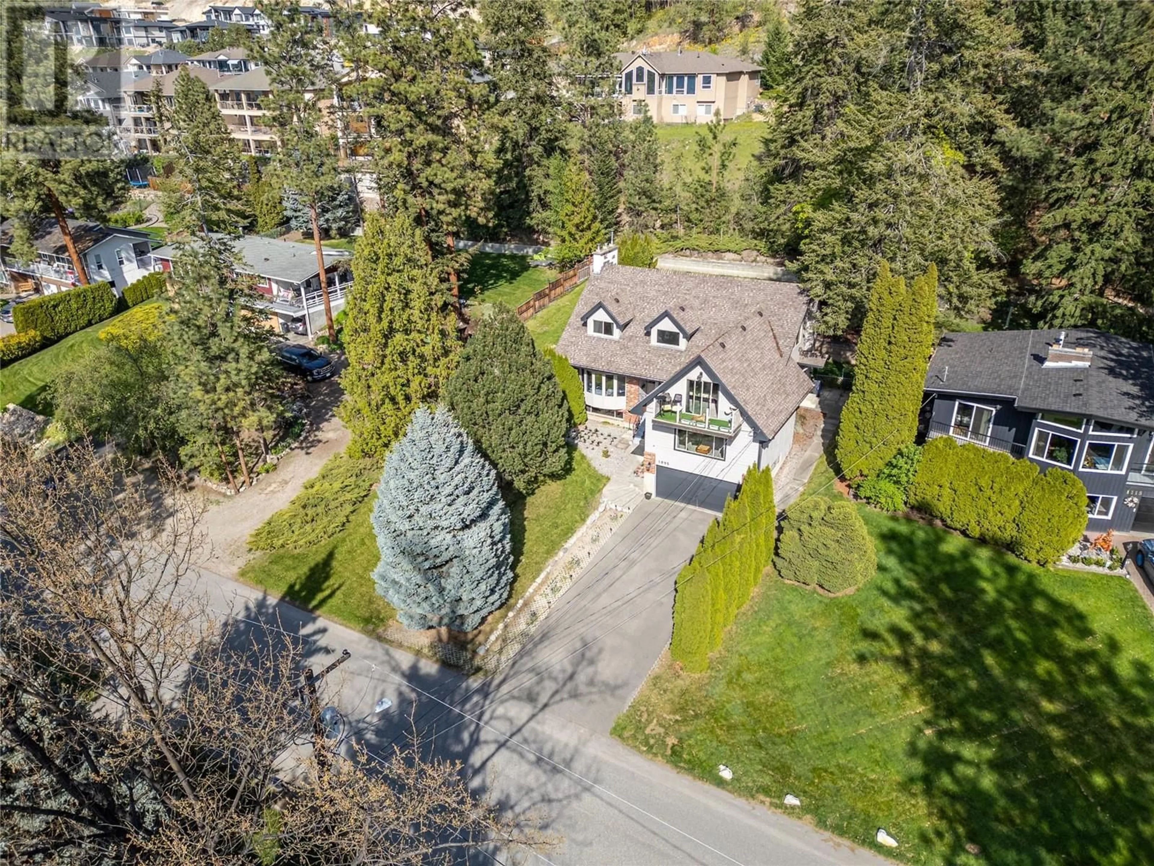 A pic from outside/outdoor area/front of a property/back of a property/a pic from drone, street for 1095 TOOVEY ROAD, Kelowna British Columbia V1X6R2