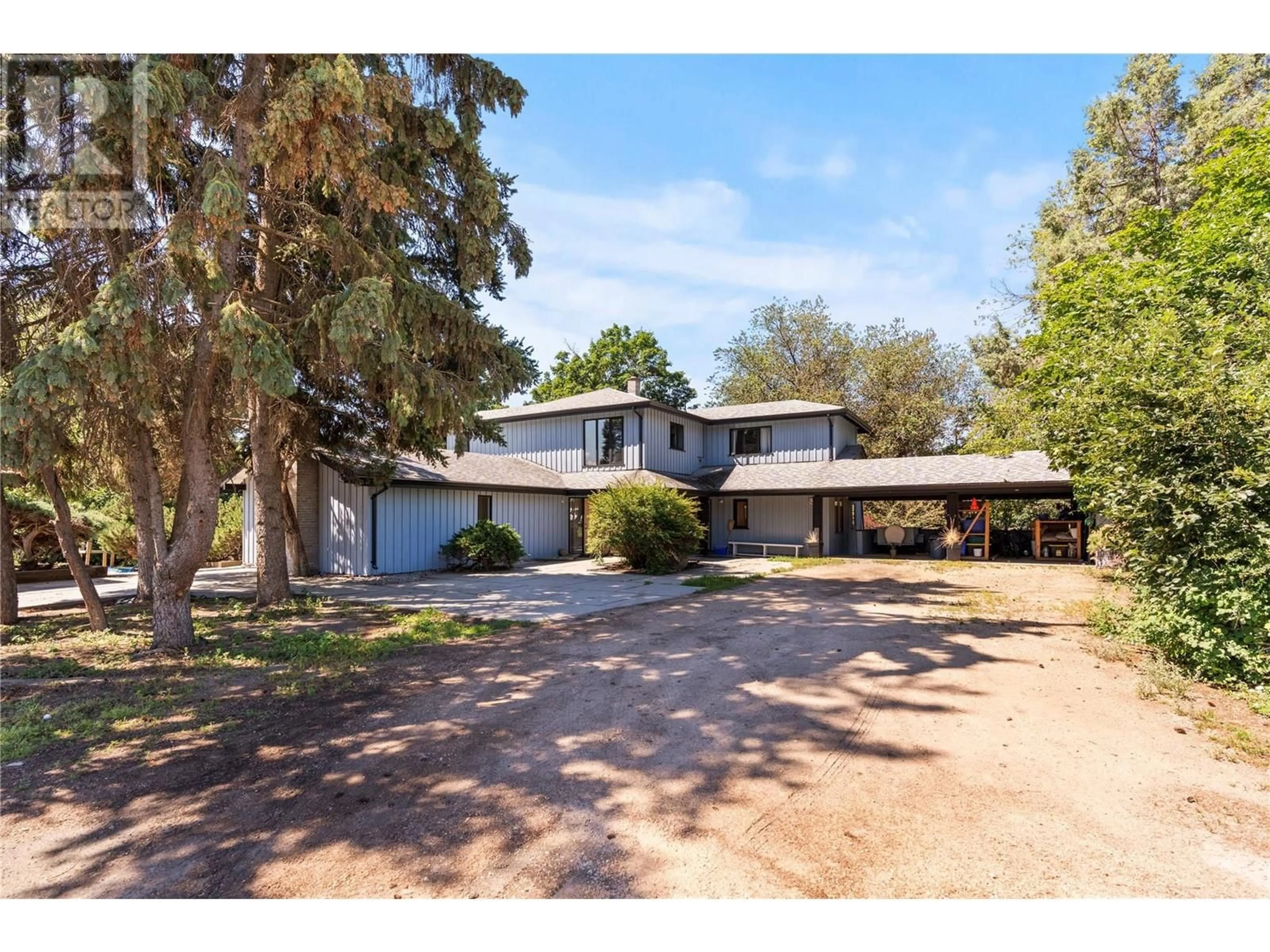 A pic from outside/outdoor area/front of a property/back of a property/a pic from drone, street for 1451 MOUNTVIEW ROAD, Vernon British Columbia V1B3A5