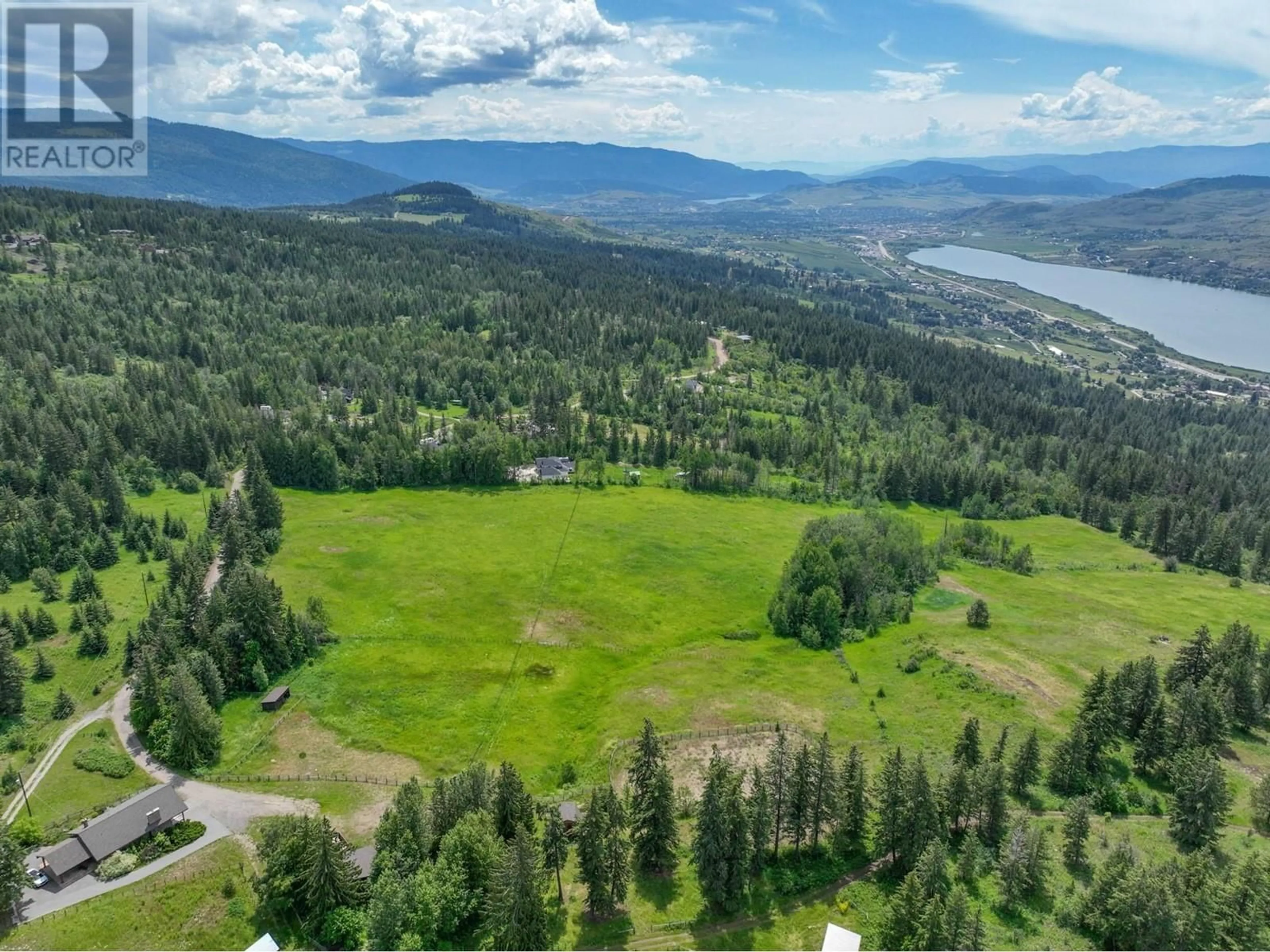 A pic from outside/outdoor area/front of a property/back of a property/a pic from drone, mountain view for 8199 MCLENNAN RD ROAD, Vernon British Columbia V1B3S7