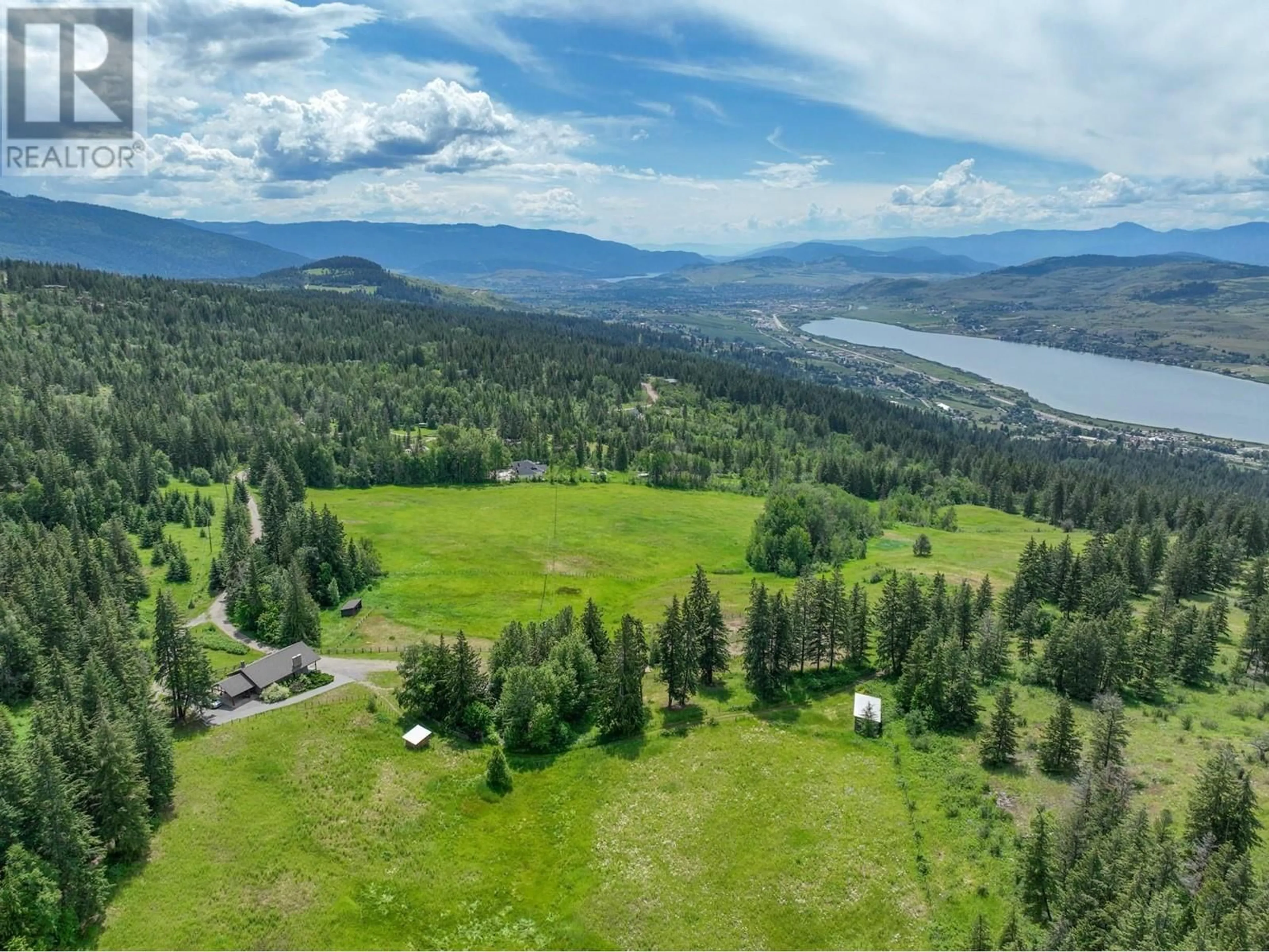 A pic from outside/outdoor area/front of a property/back of a property/a pic from drone, water/lake/river/ocean view for 8199 MCLENNAN RD ROAD, Vernon British Columbia V1B3S7