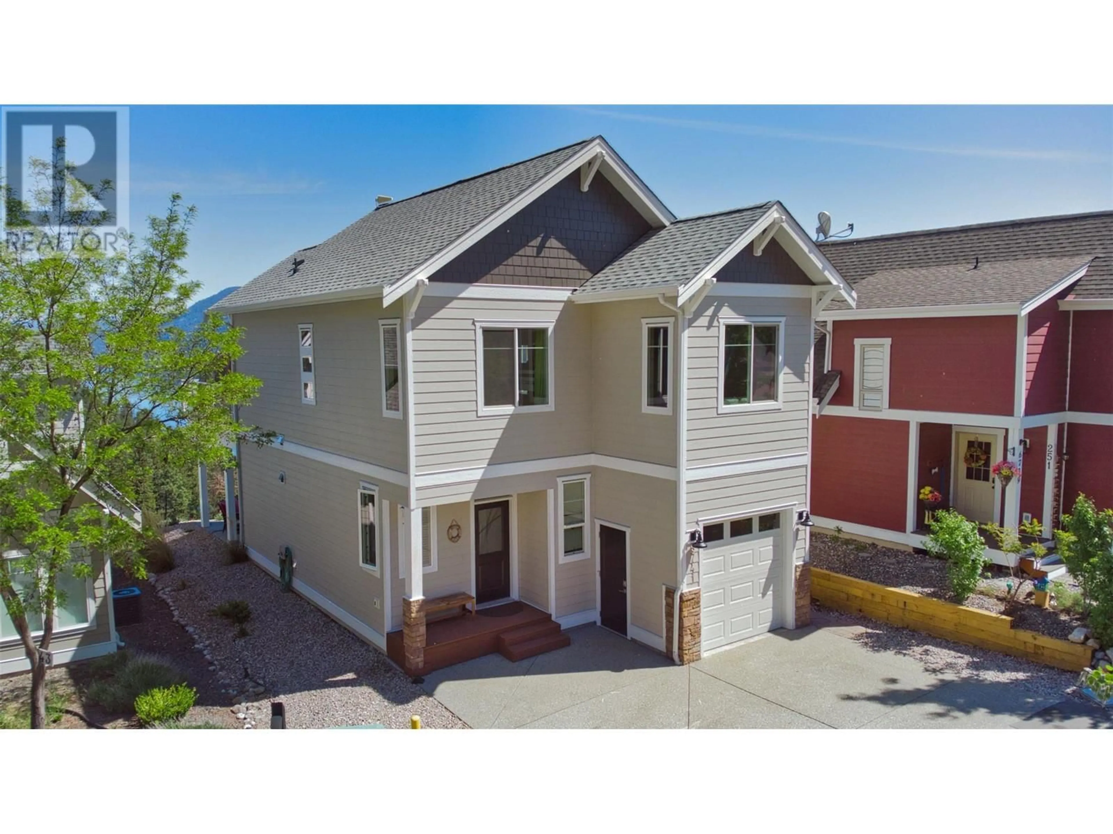 A pic from outside/outdoor area/front of a property/back of a property/a pic from drone, street for 252 - 6741 LA PALMA LOOP, Kelowna British Columbia V1Z3R8