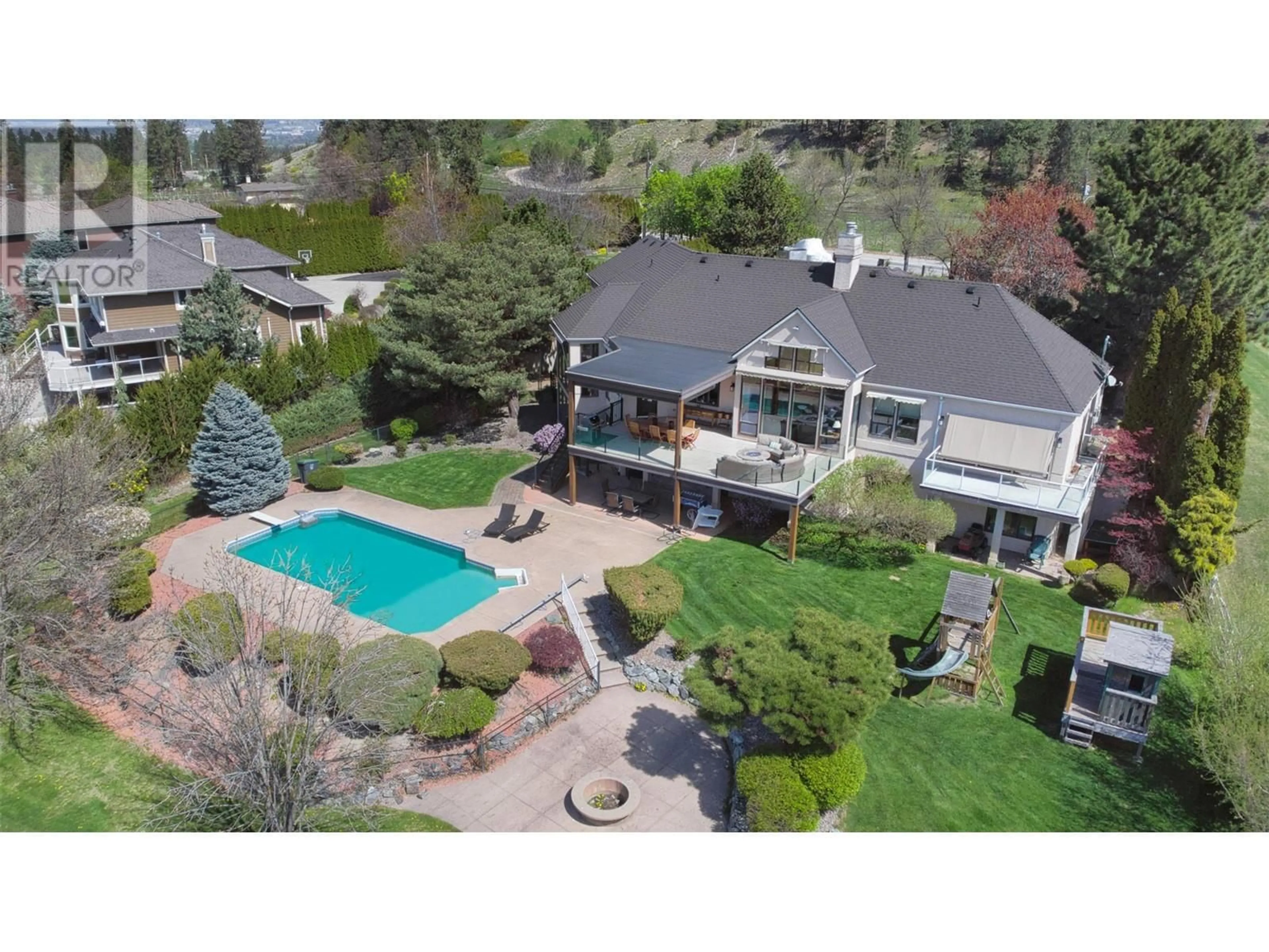 A pic from outside/outdoor area/front of a property/back of a property/a pic from drone, unknown for 1117 CRAWFORD ROAD, Kelowna British Columbia V1W4N4