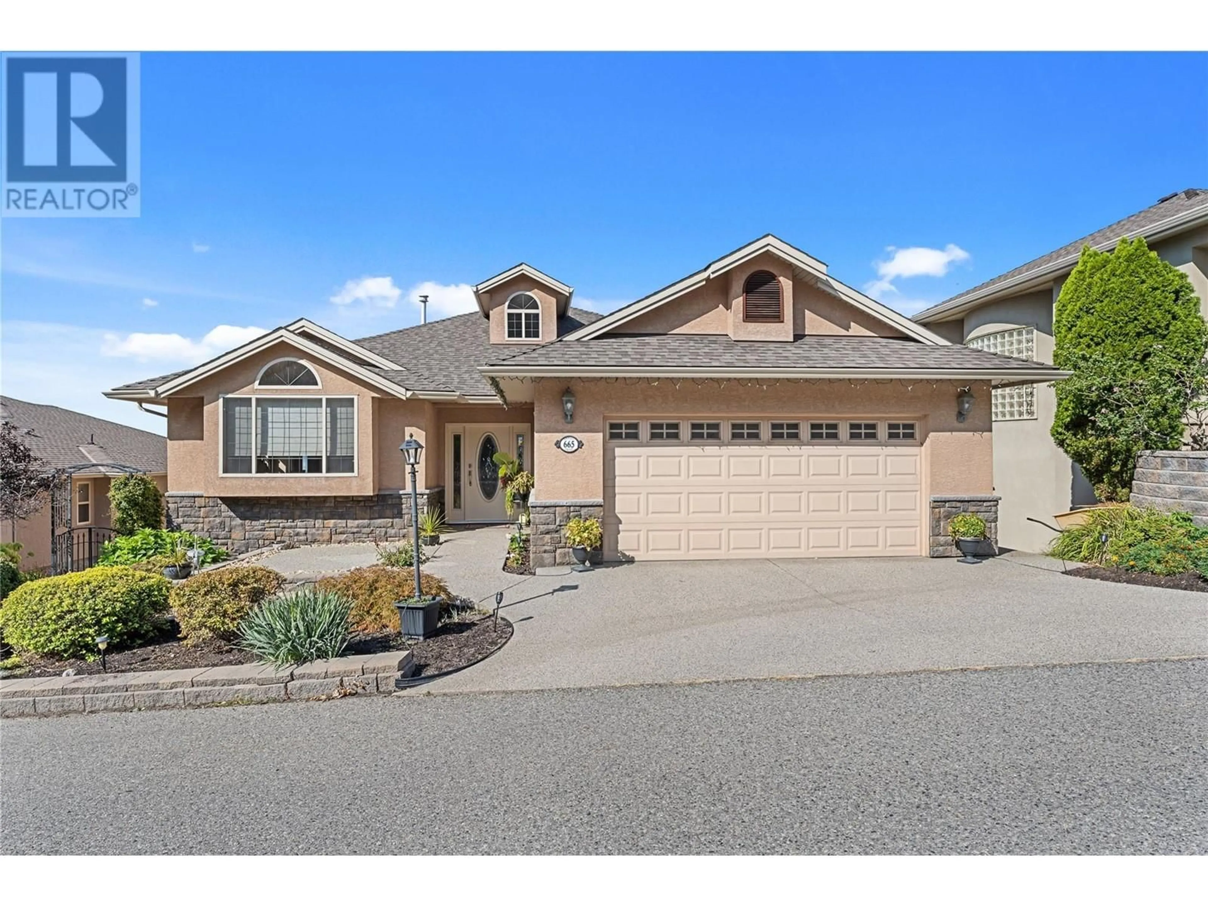 Home with vinyl exterior material, street for 665 DENALI DRIVE, Kelowna British Columbia V1V2P5