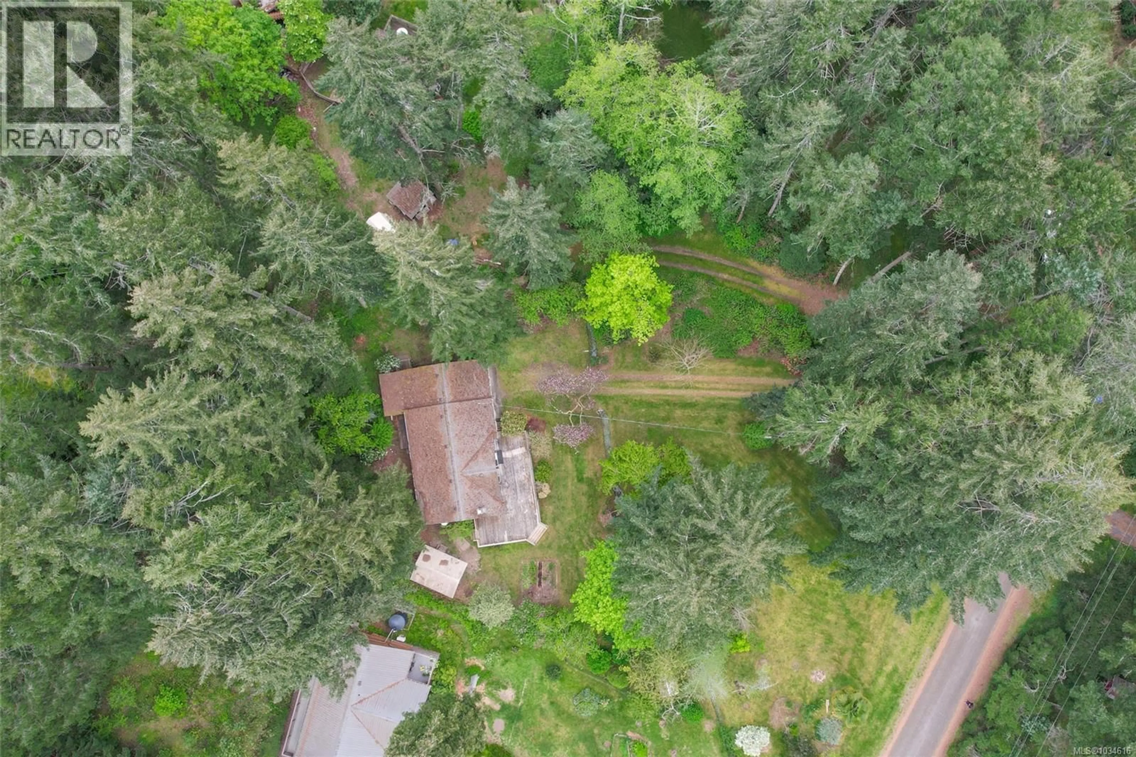A pic from outside/outdoor area/front of a property/back of a property/a pic from drone, forest/trees view for 2420 SPRING BEACH DRIVE, Gabriola Island British Columbia V0R1X7