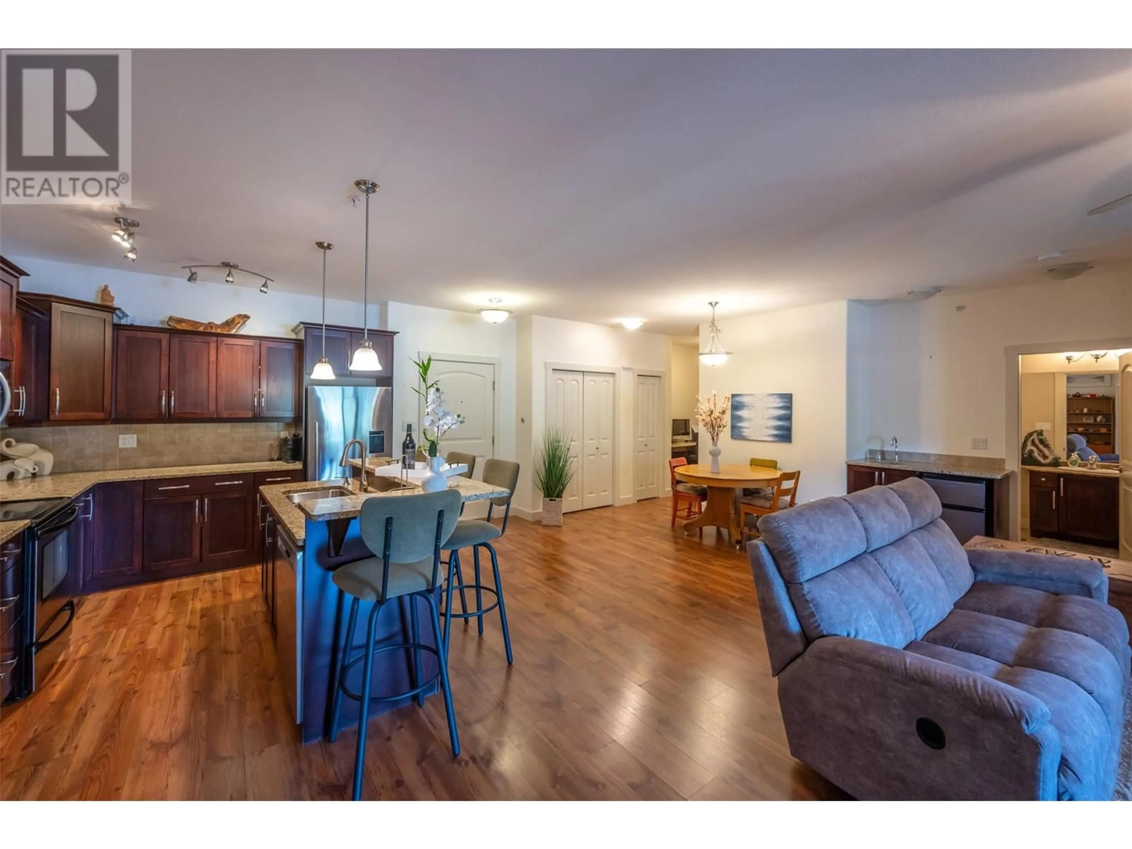 Open concept kitchen, wood/laminate floor for 401 - 13615 VICTORIA ROAD NORTH, Summerland British Columbia V0H1Z5