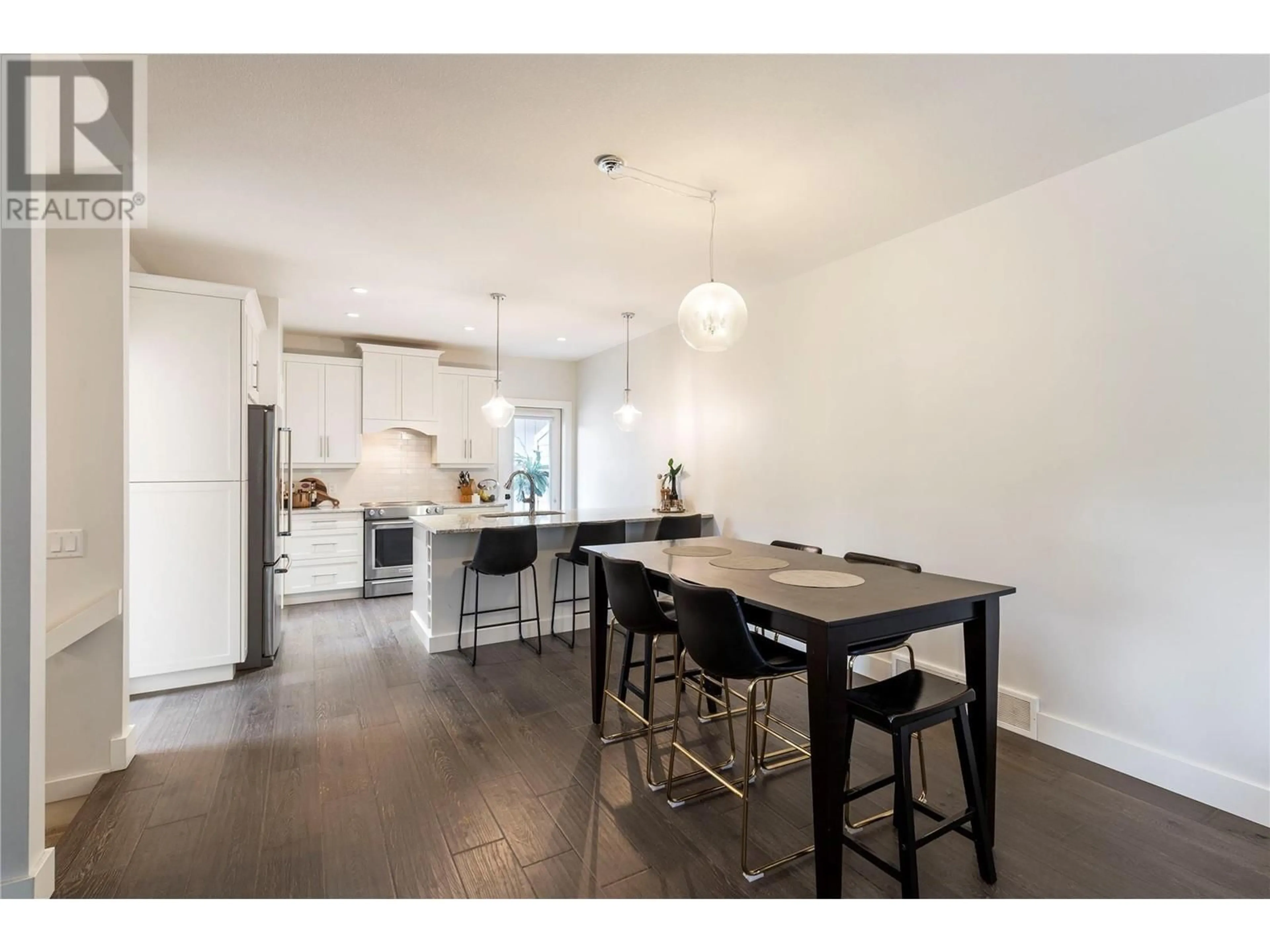 Open concept kitchen, wood/laminate floor for 1 - 644 LEQUIME ROAD, Kelowna British Columbia V1W1A4