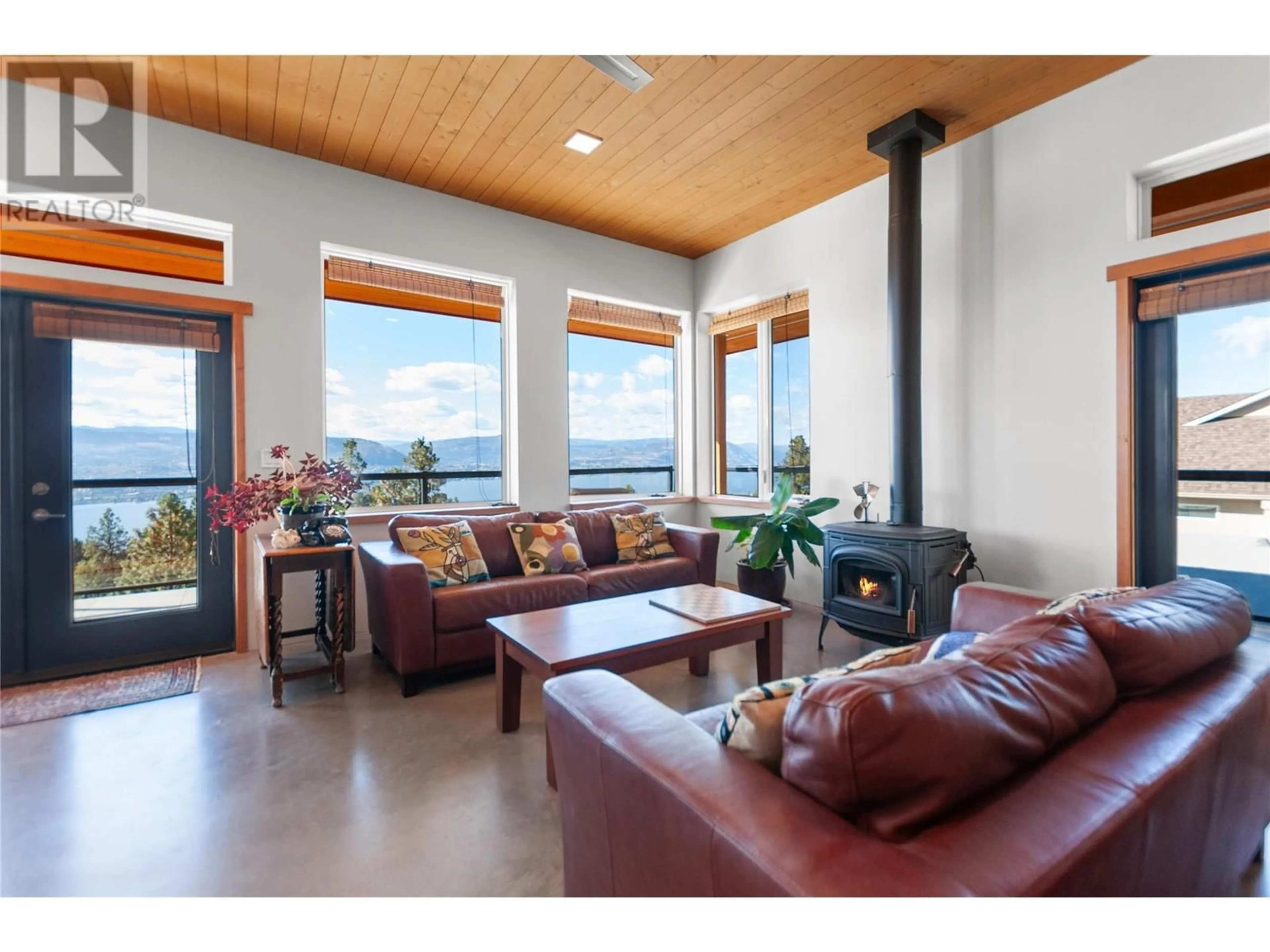 Living room with furniture, wood/laminate floor for 2750 NOYES ROAD, Naramata British Columbia V0H1N1