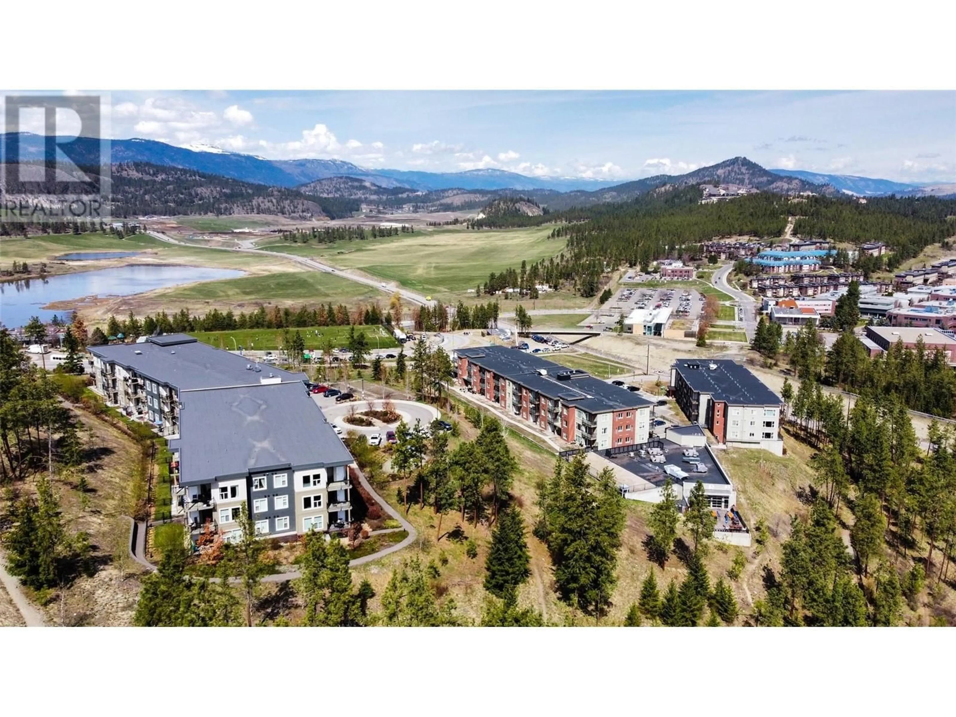 A pic from outside/outdoor area/front of a property/back of a property/a pic from drone, mountain view for 118 - 935 ACADEMY WAY, Kelowna British Columbia V1V3A9