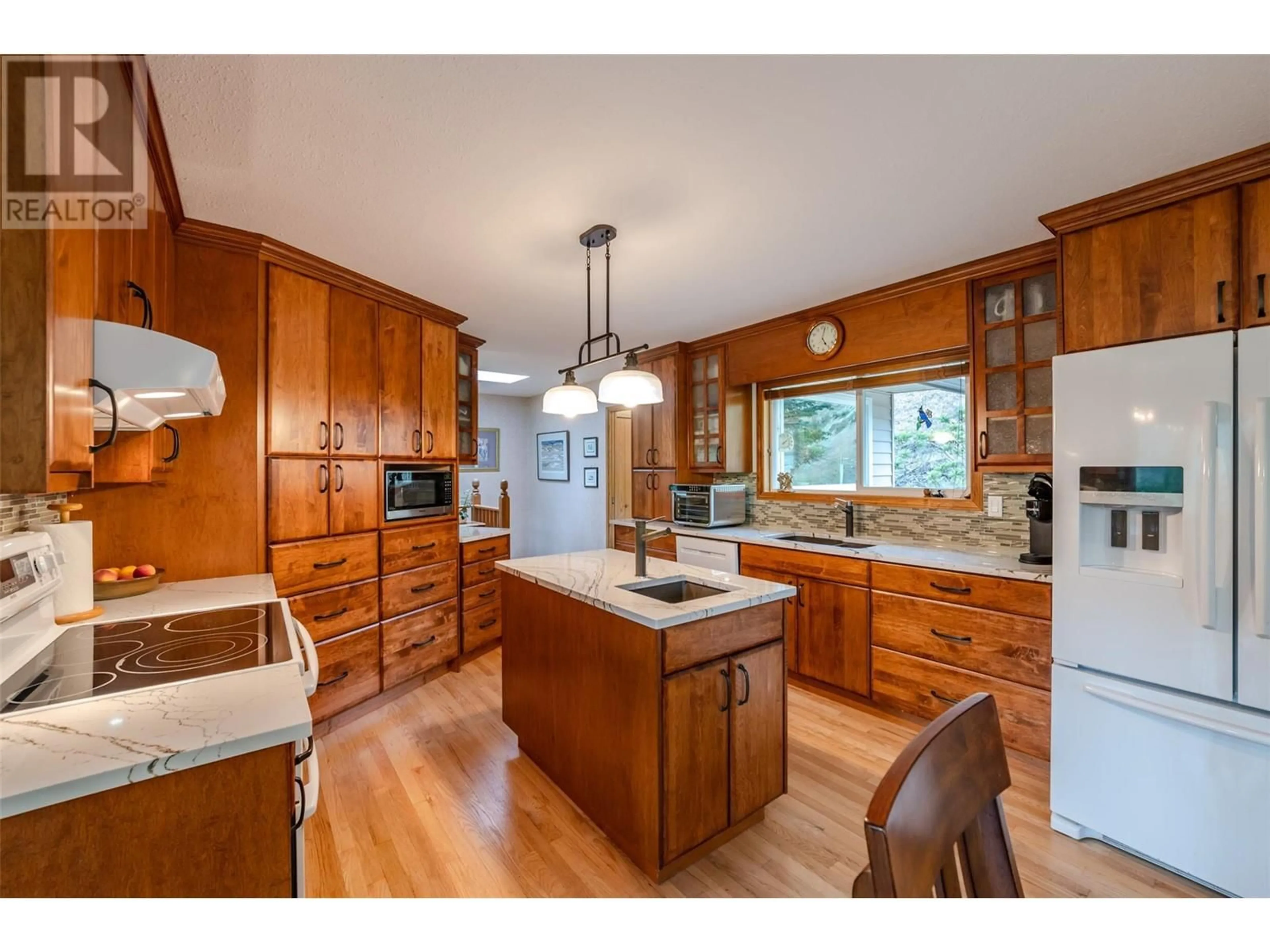 Open concept kitchen, wood/laminate floor for 331 EASTSIDE ROAD, Okanagan Falls British Columbia V0H1R5