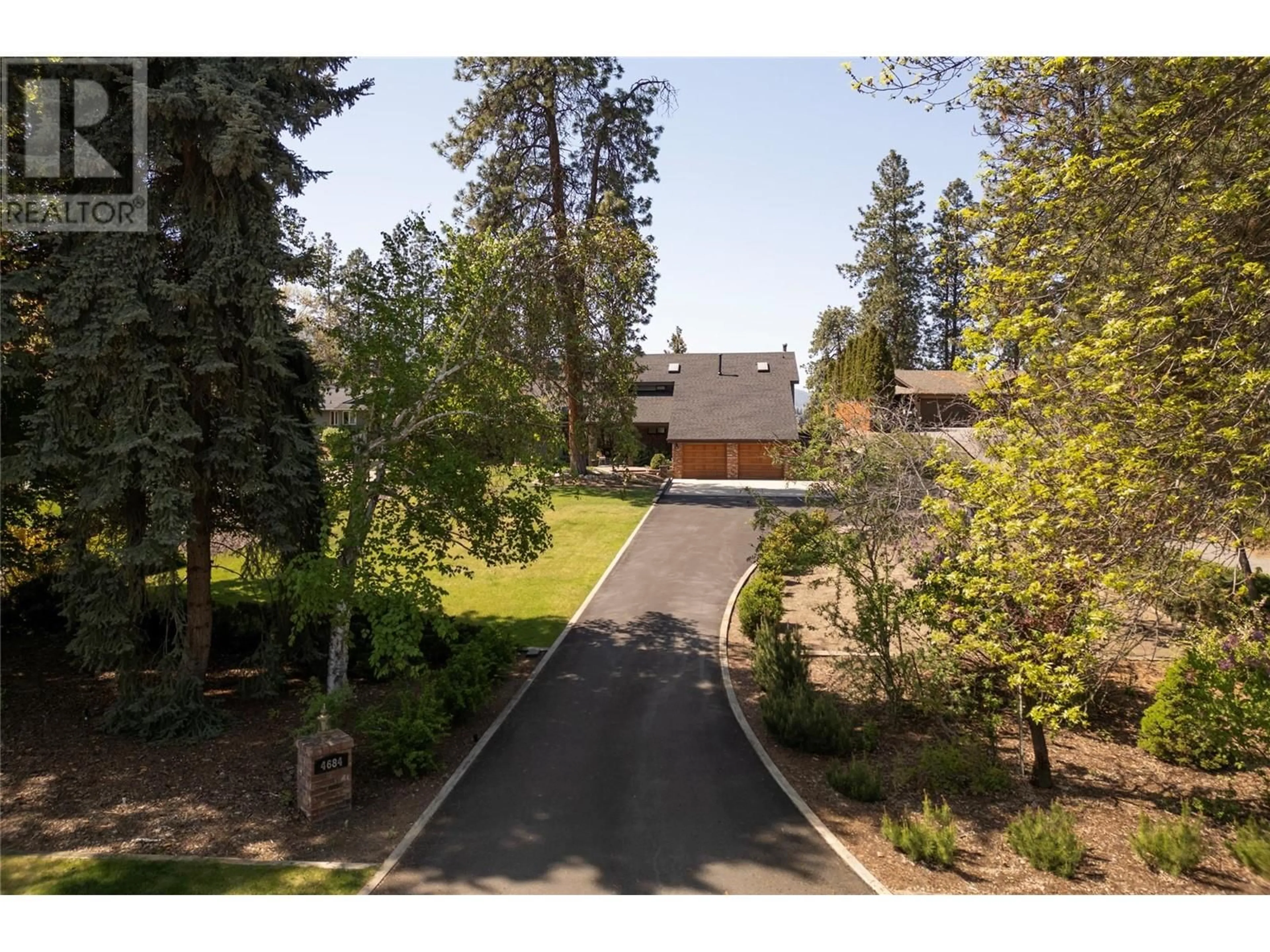 A pic from outside/outdoor area/front of a property/back of a property/a pic from drone, mountain view for 4684 WESTRIDGE DRIVE, Kelowna British Columbia V1W3A8