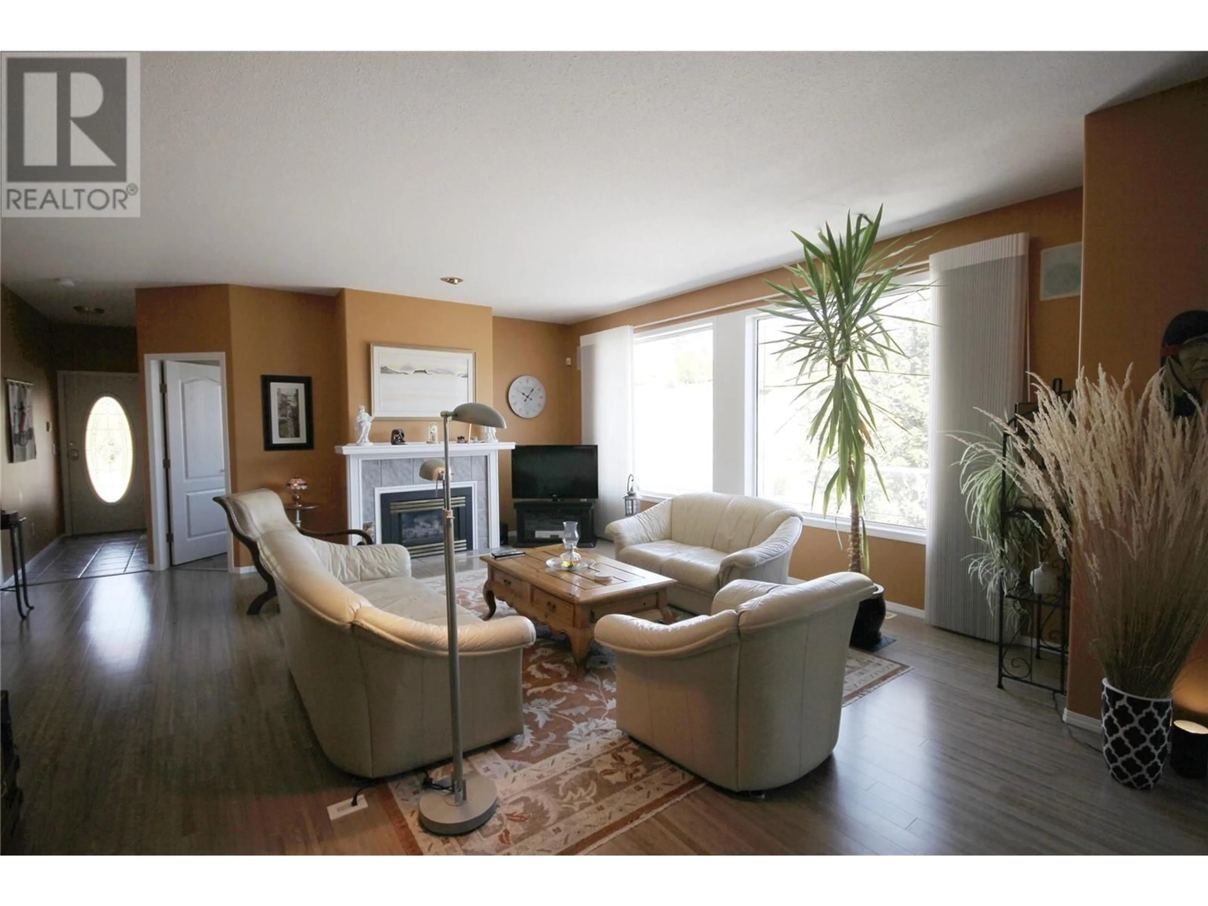 Living room with furniture, wood/laminate floor for 396 RIDGE ROAD, Penticton British Columbia V2A8N7