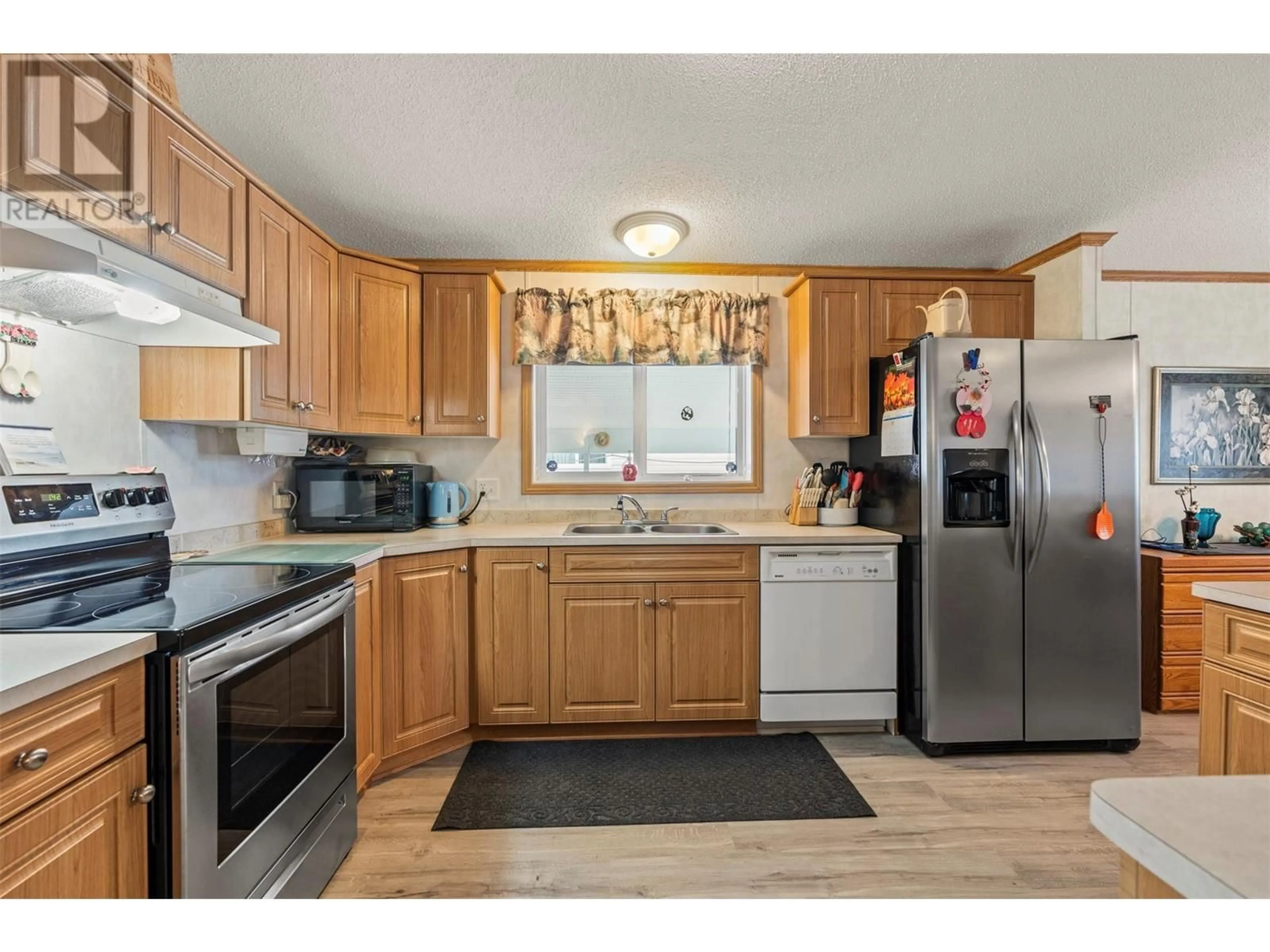 Standard kitchen, wood/laminate floor for 71 - 6688 TRONSON ROAD, Vernon British Columbia V1H1R9