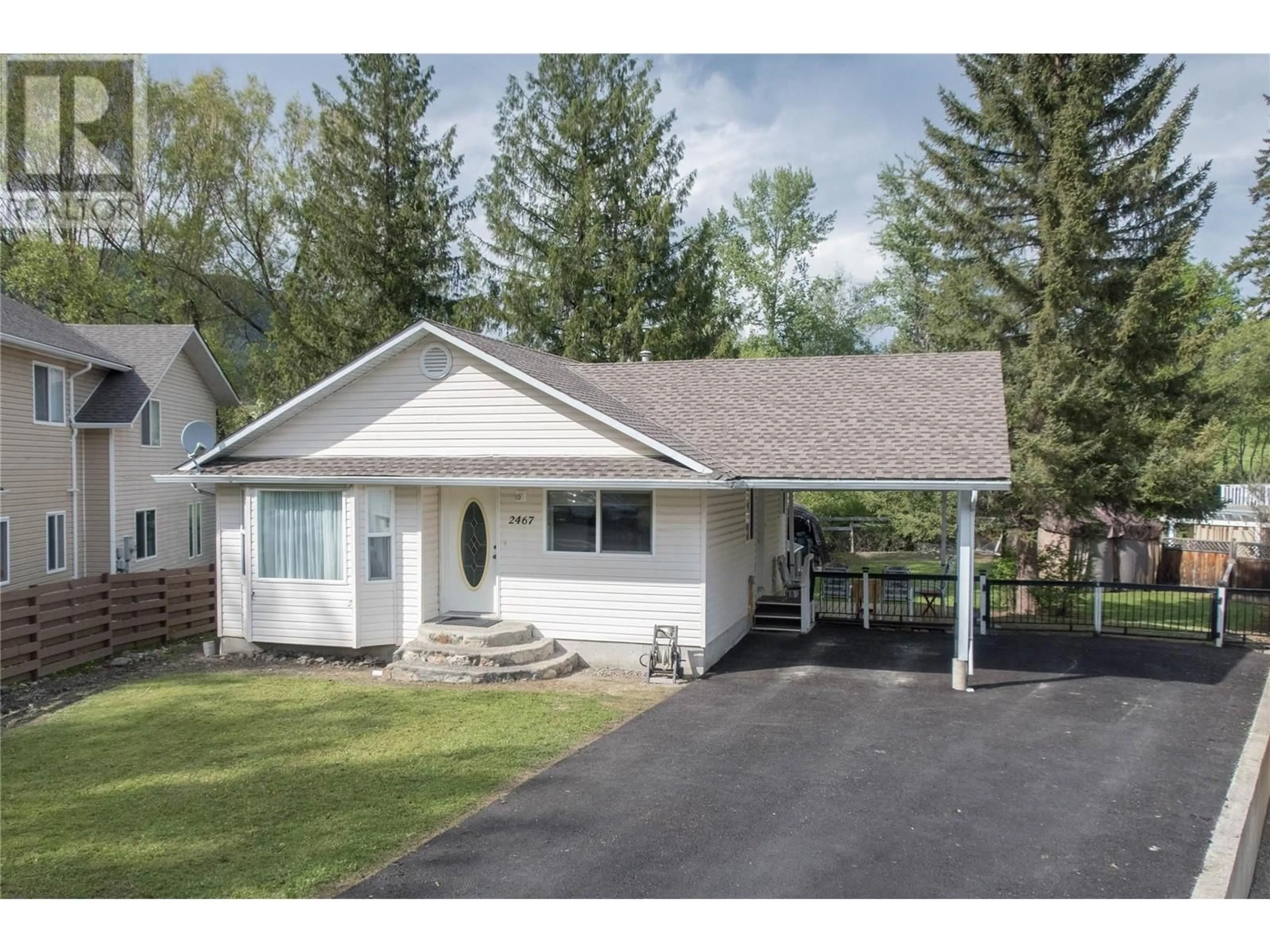 Home with vinyl exterior material, street for 2467 SPRUCE AVENUE, Lumby British Columbia V0E2G5