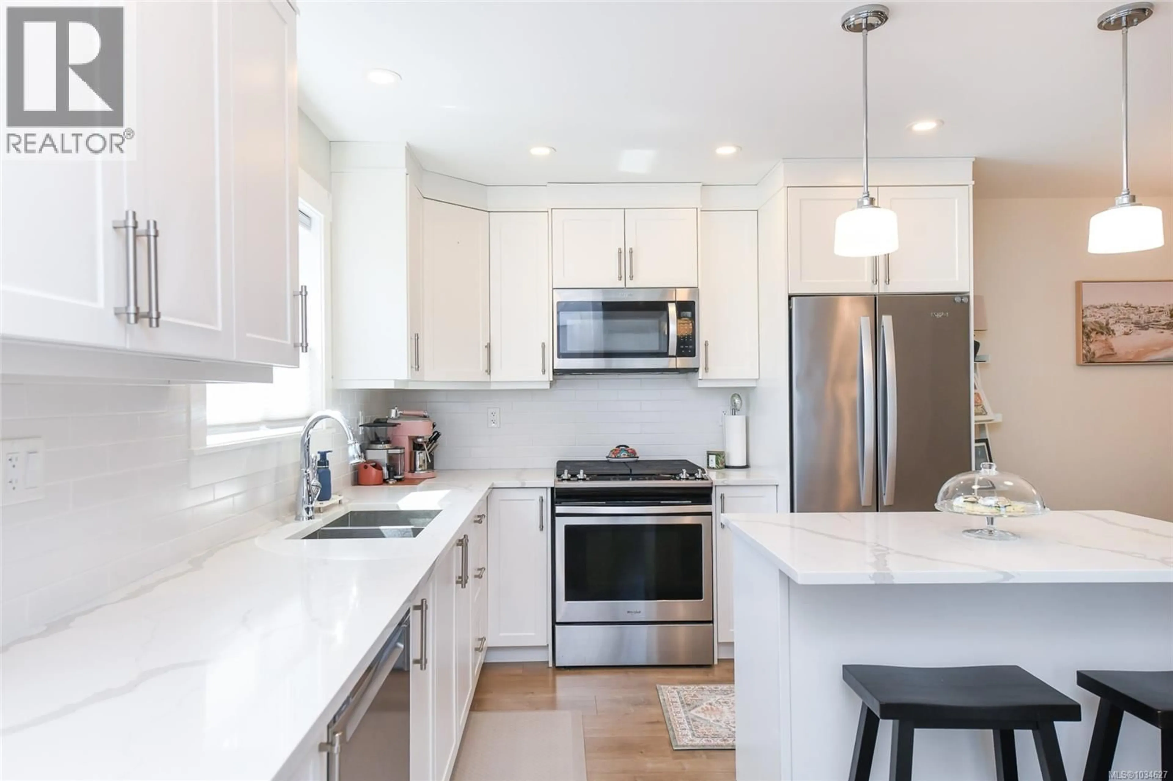 Open concept kitchen, ceramic/tile floor for 104 - 2485 IDIENS WAY, Courtenay British Columbia V9N9J4