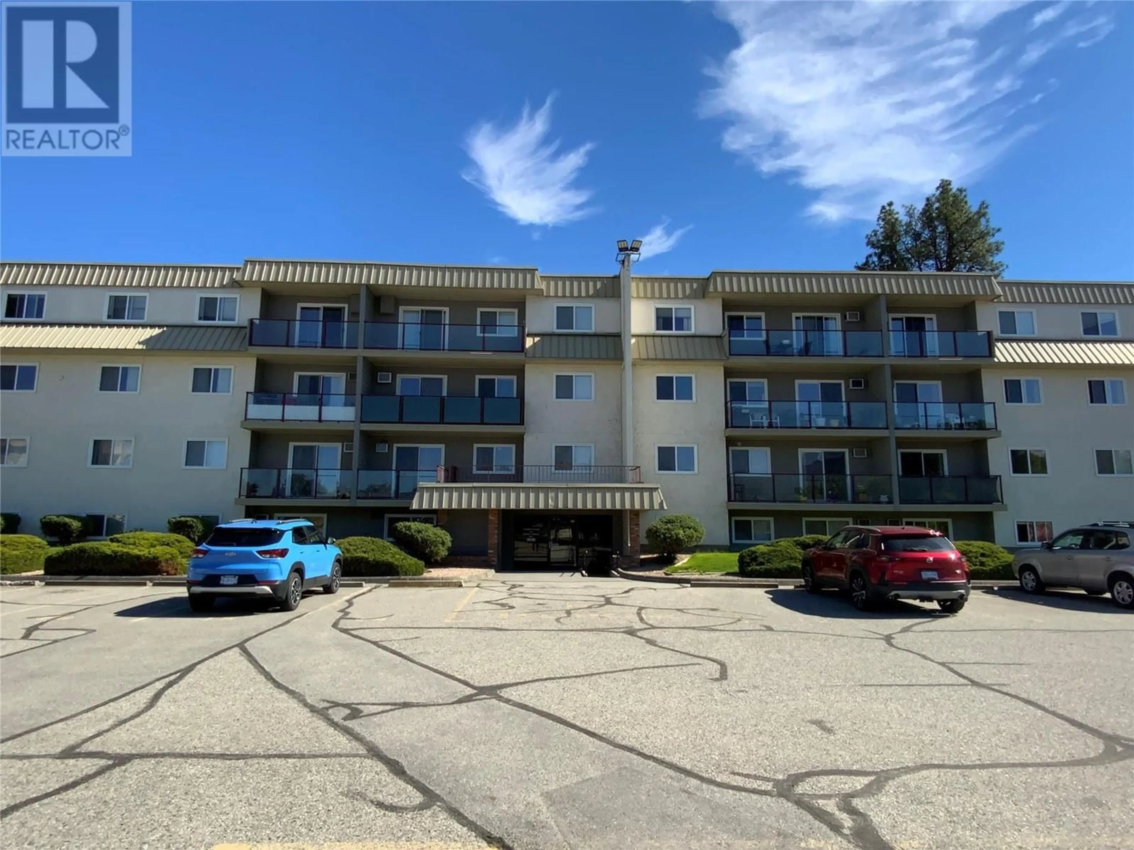 A pic from outside/outdoor area/front of a property/back of a property/a pic from drone, unknown for 401 - 110 SKAHA PLACE, Penticton British Columbia V2A7L1
