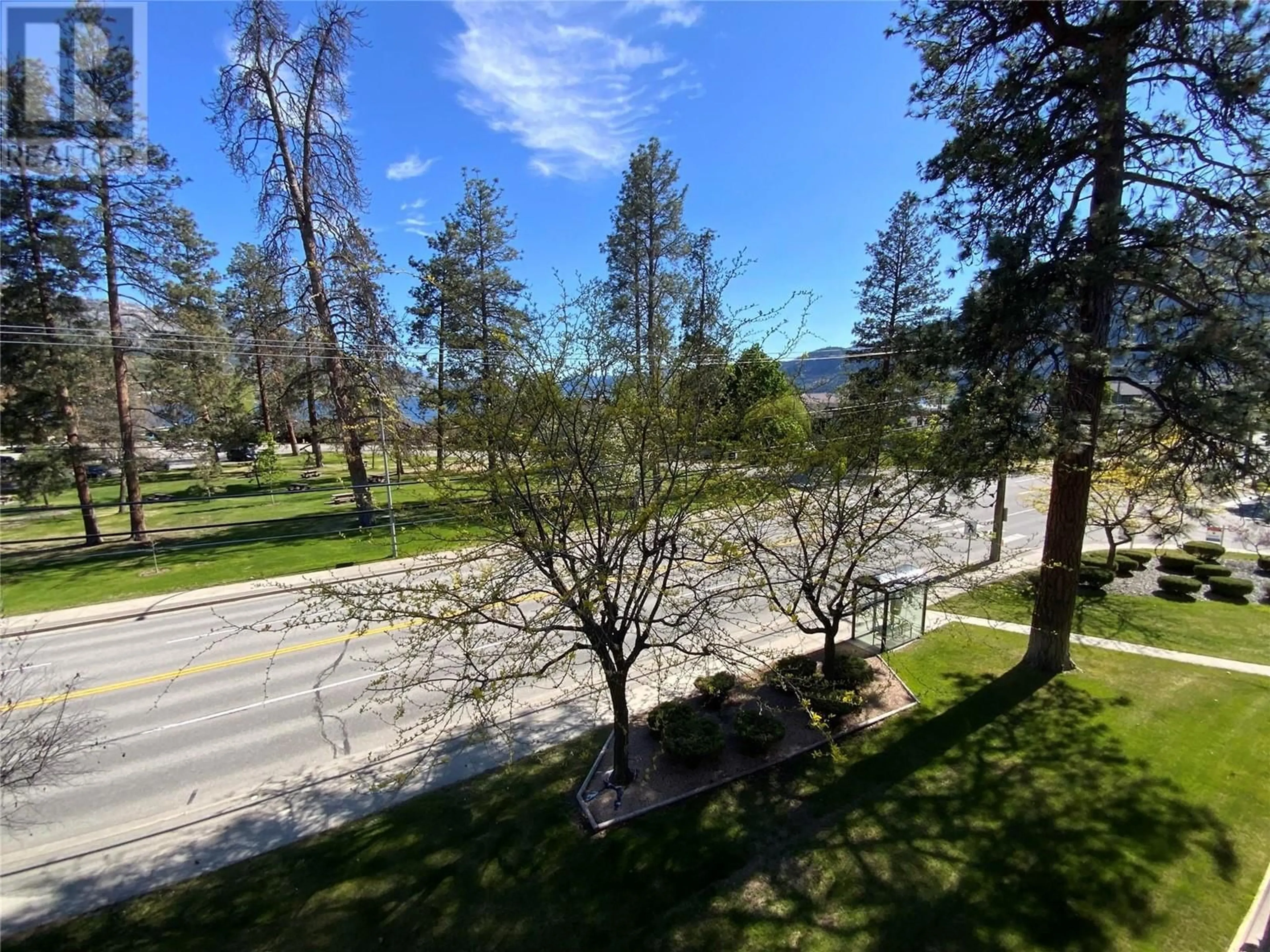 A pic from outside/outdoor area/front of a property/back of a property/a pic from drone, forest/trees view for 401 - 110 SKAHA PLACE, Penticton British Columbia V2A7L1