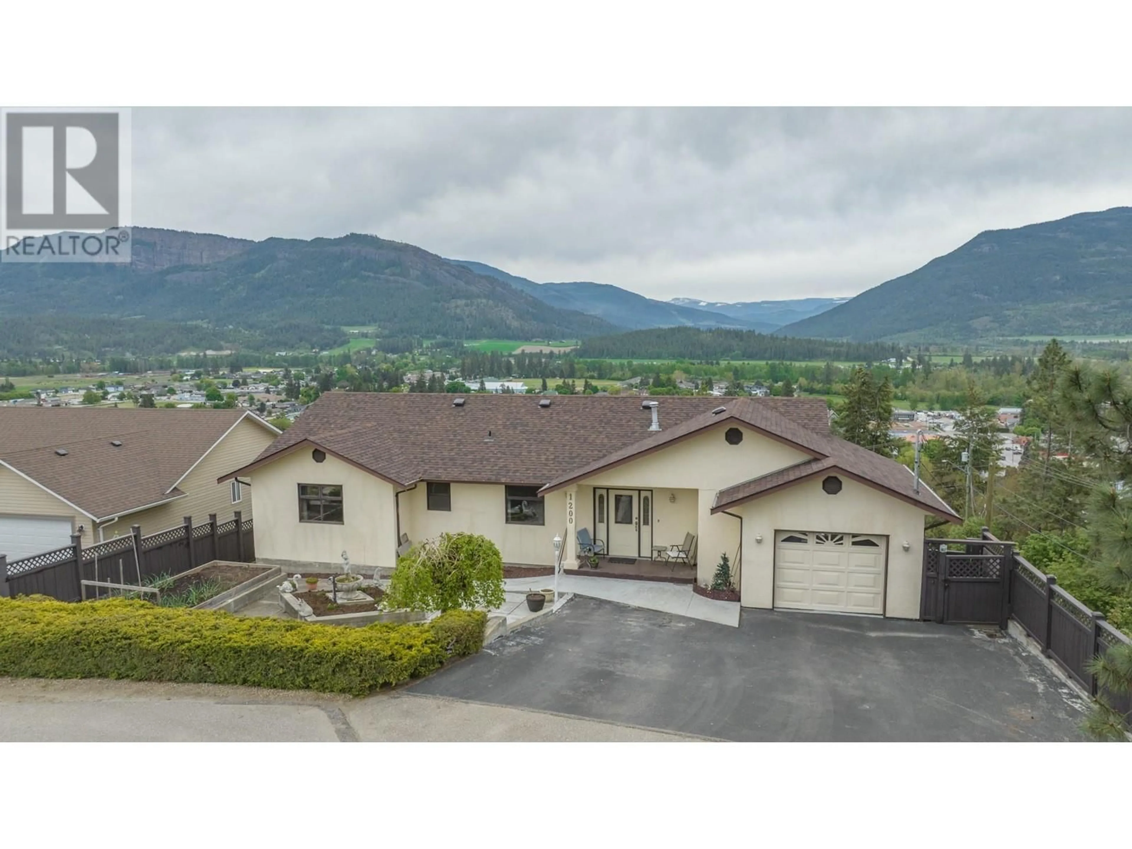 A pic from outside/outdoor area/front of a property/back of a property/a pic from drone, mountain view for 1200 LAWES STREET, Enderby British Columbia V0E1V0