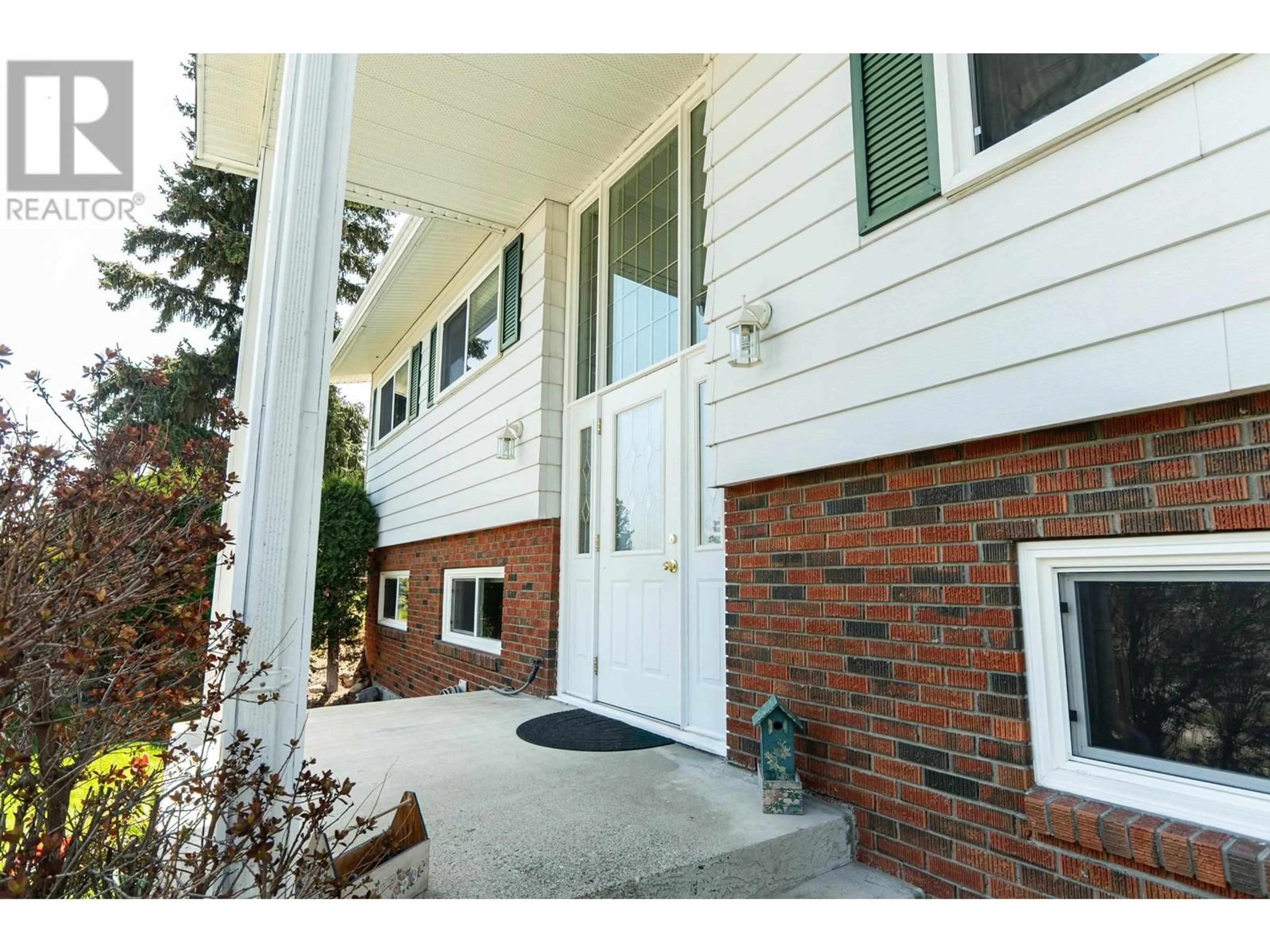 Home with vinyl exterior material, street for 3292 MCIVER ROAD, West Kelowna British Columbia V4T1G2