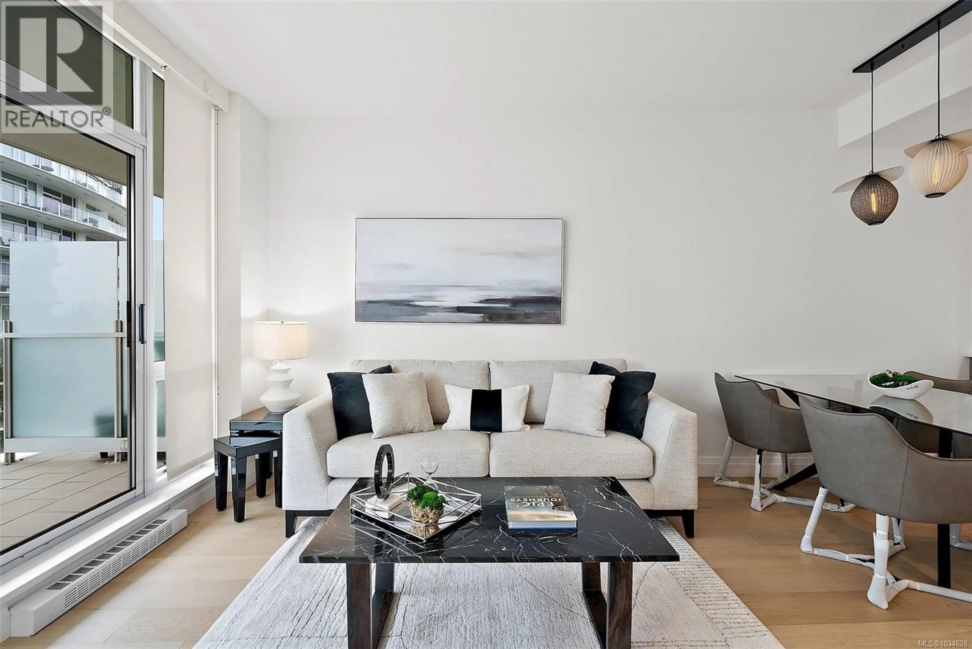 Living room with furniture, wood/laminate floor for 519 - 68 SONGHEES ROAD, Victoria British Columbia V9A0A3