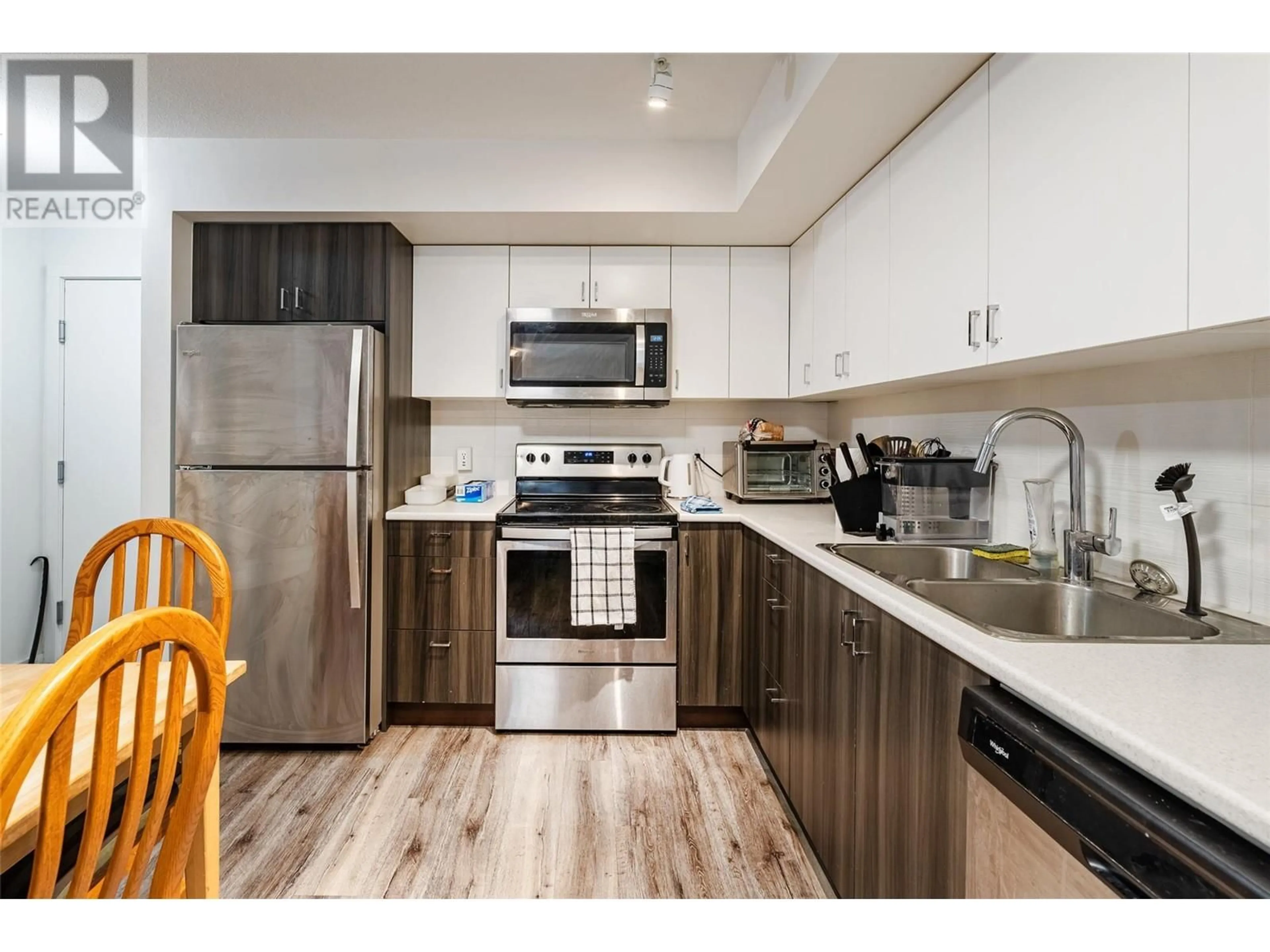 Standard kitchen, wood/laminate floor for 110 - 655 ACADEMY WAY, Kelowna British Columbia V1V3A4