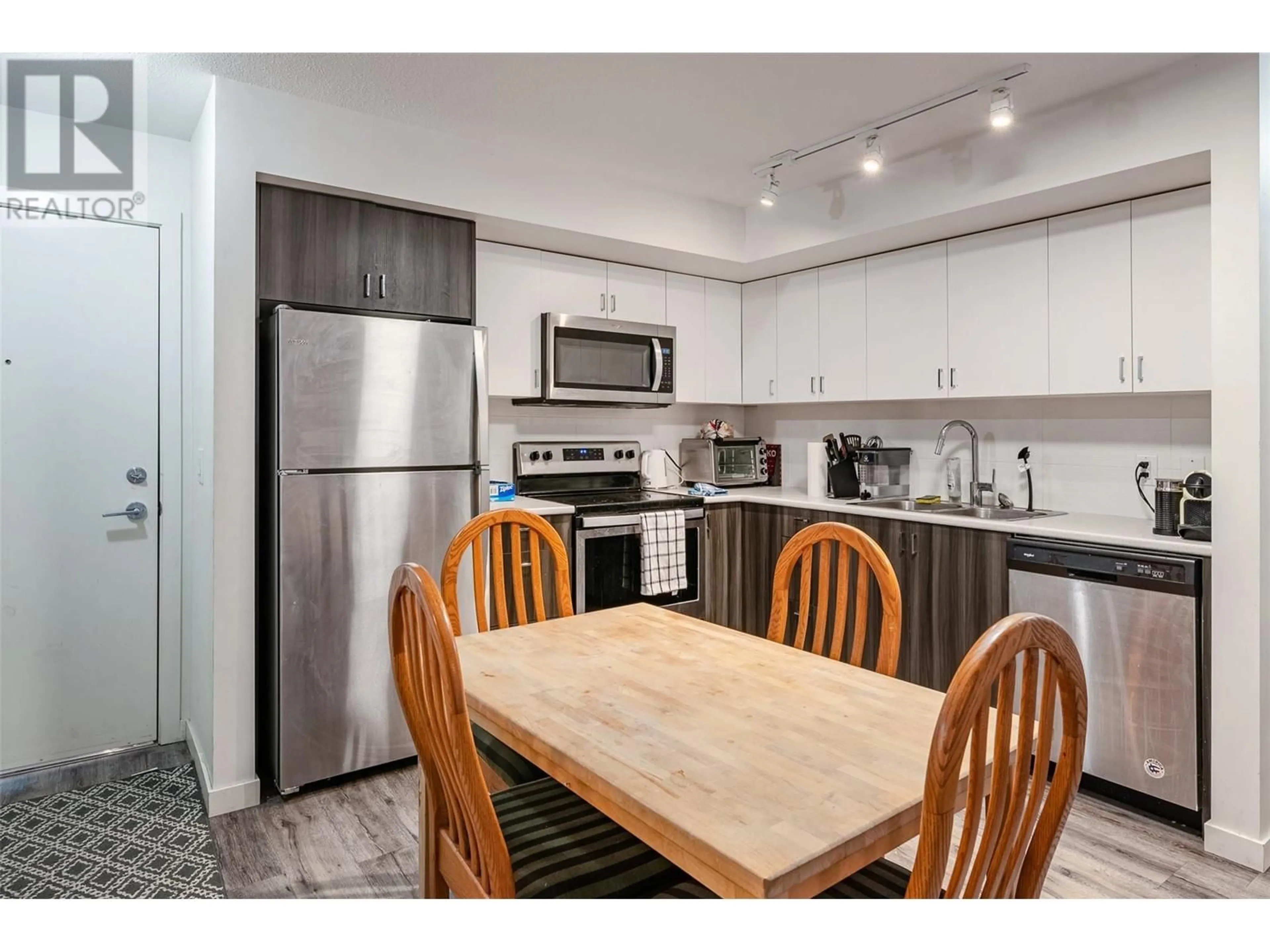 Standard kitchen, wood/laminate floor for 110 - 655 ACADEMY WAY, Kelowna British Columbia V1V3A4