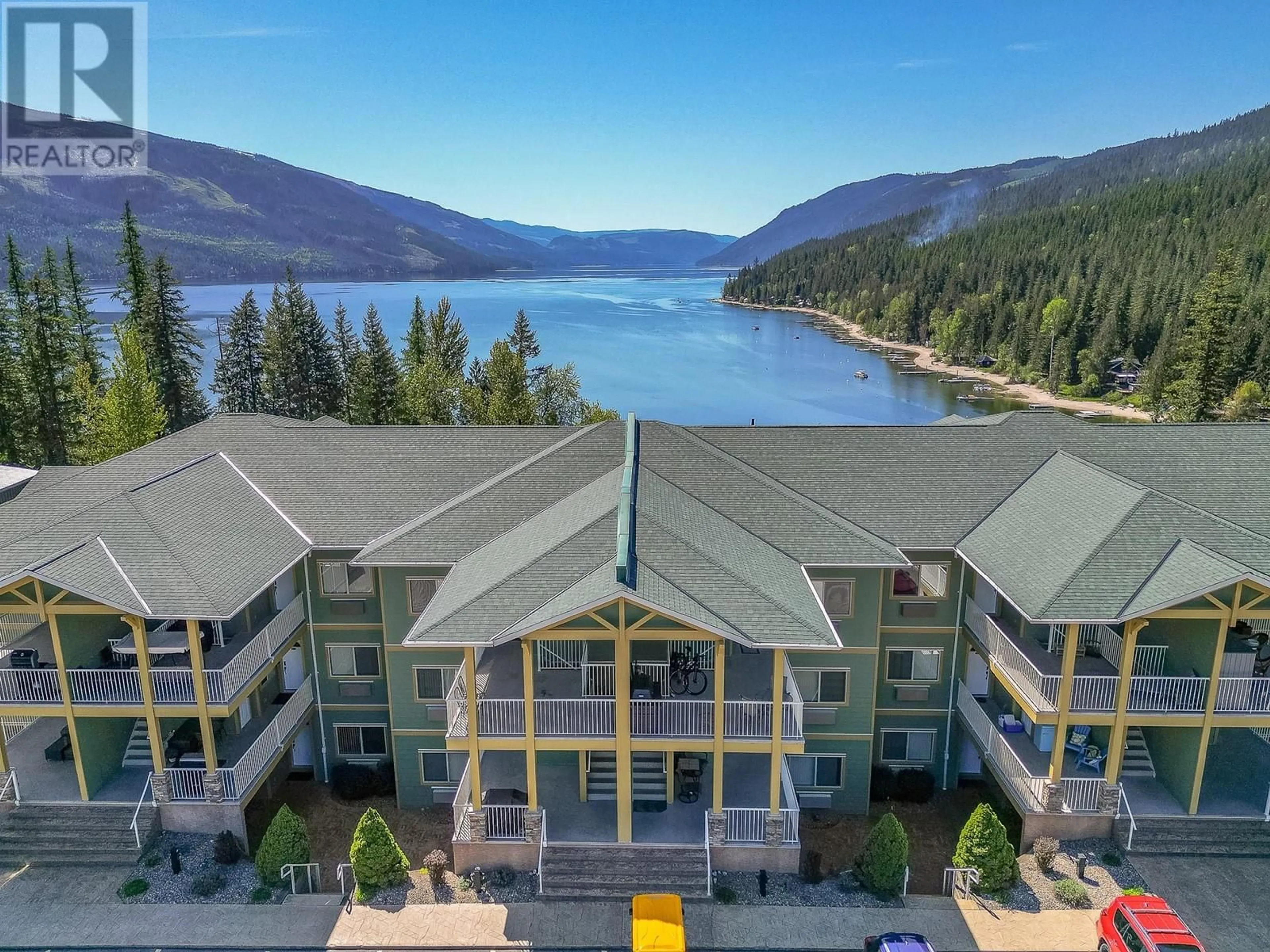A pic from outside/outdoor area/front of a property/back of a property/a pic from drone, water/lake/river/ocean view for A304 - 3460 PARKWAY ROAD, Enderby British Columbia V0E1V5
