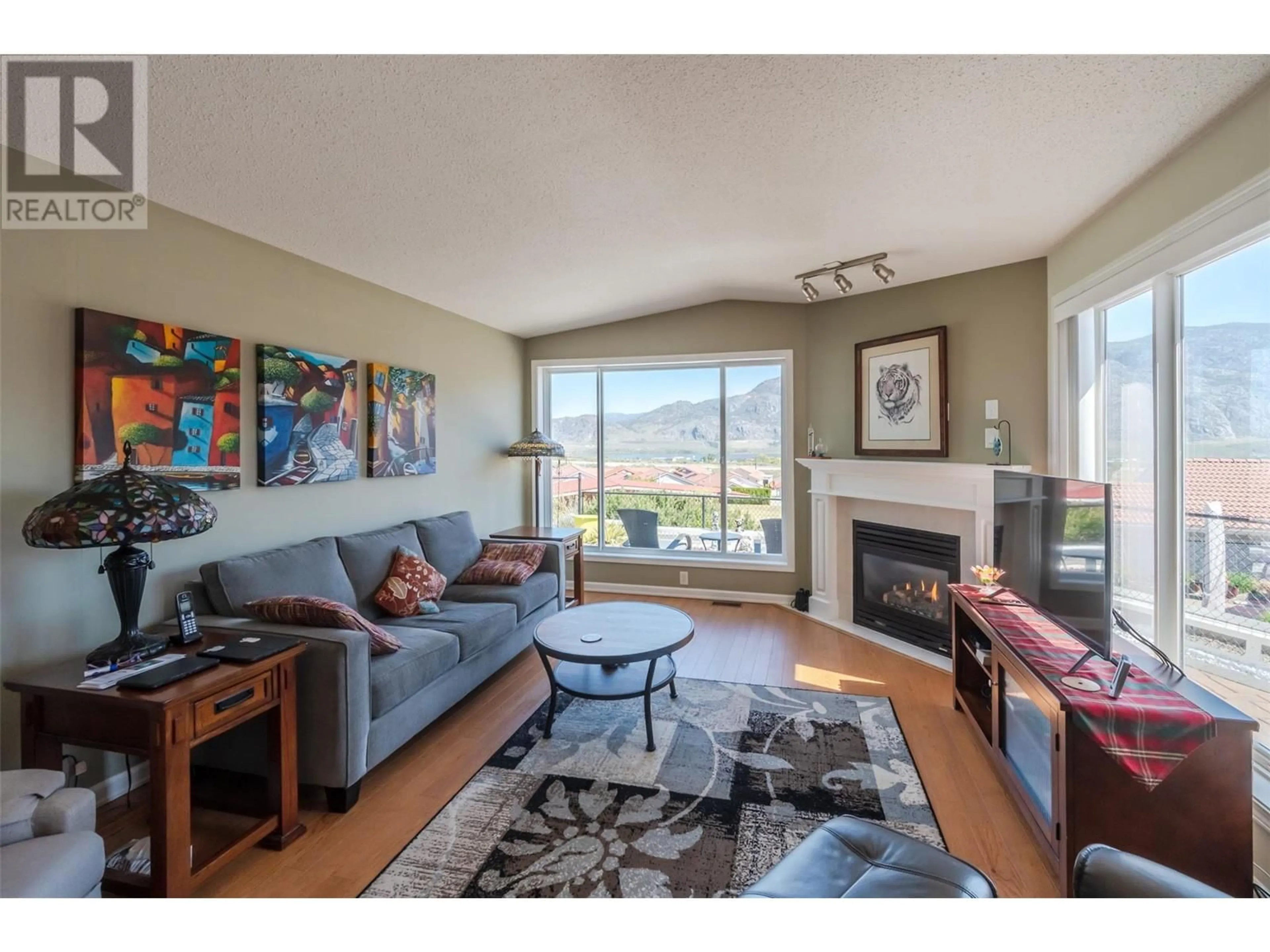 Living room with furniture, wood/laminate floor for 49 - 9400 115 STREET, Osoyoos British Columbia V0H1V5
