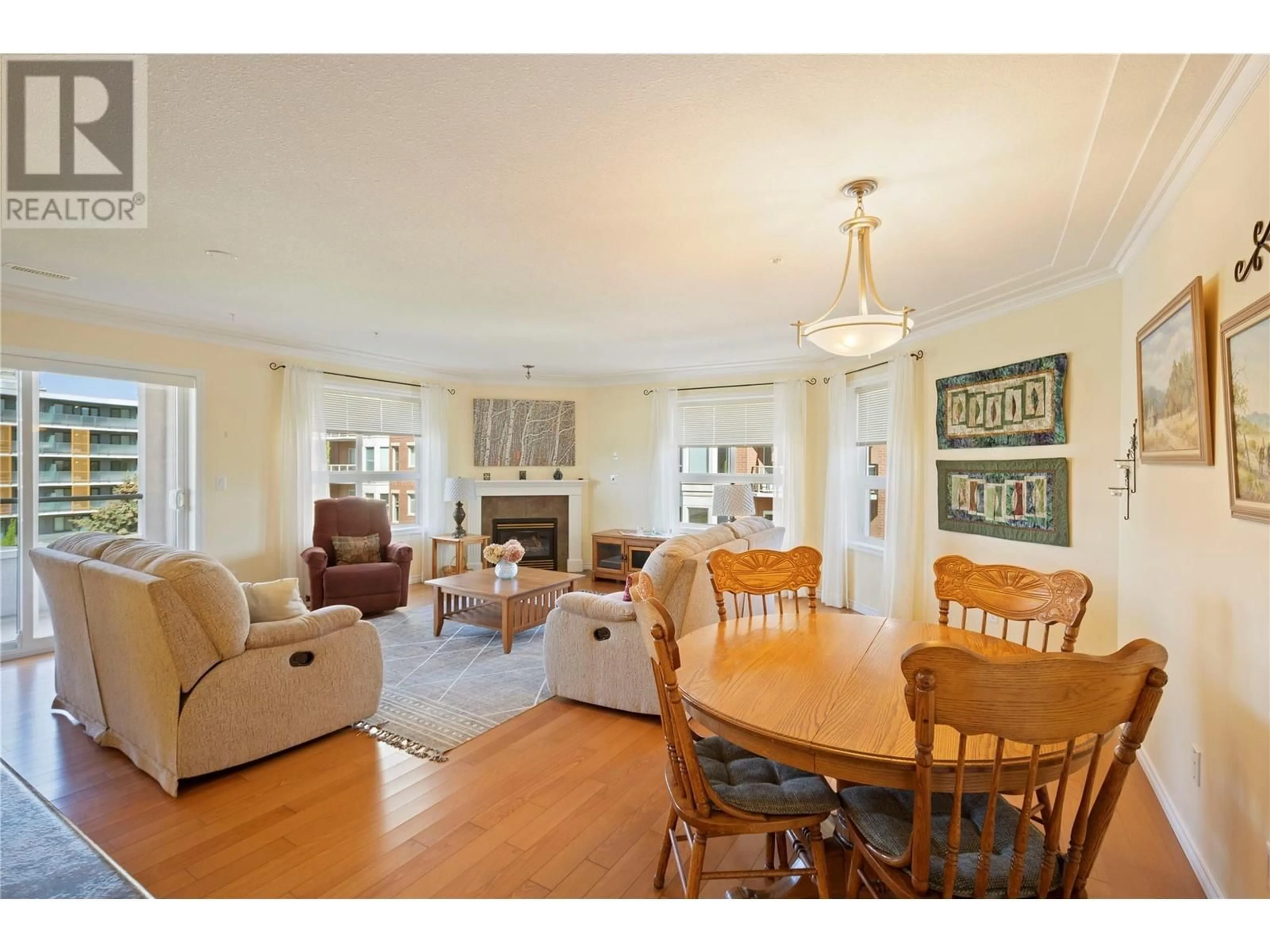 Living room with furniture, wood/laminate floor for 401 - 1967 UNDERHILL STREET, Kelowna British Columbia V1X8C9
