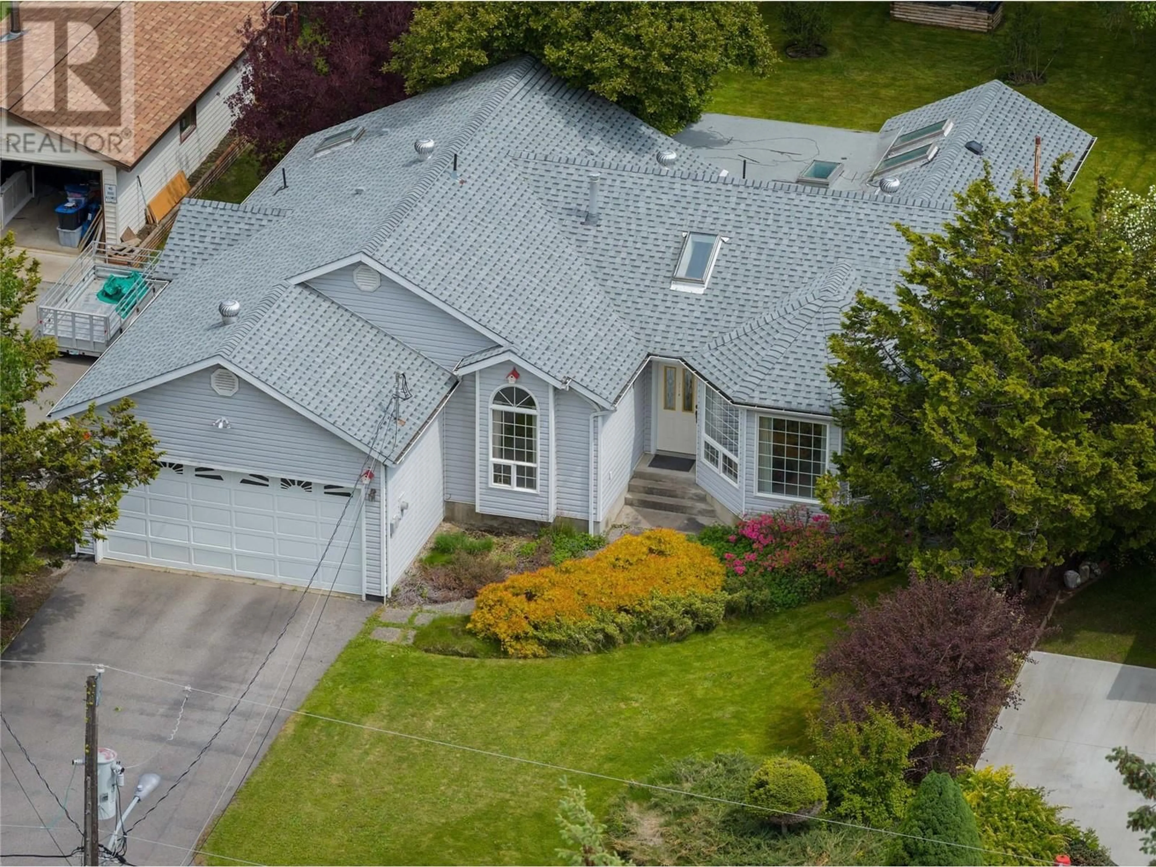A pic from outside/outdoor area/front of a property/back of a property/a pic from drone, street for 2718 FIR DRIVE, South Slocan British Columbia V0G2G1