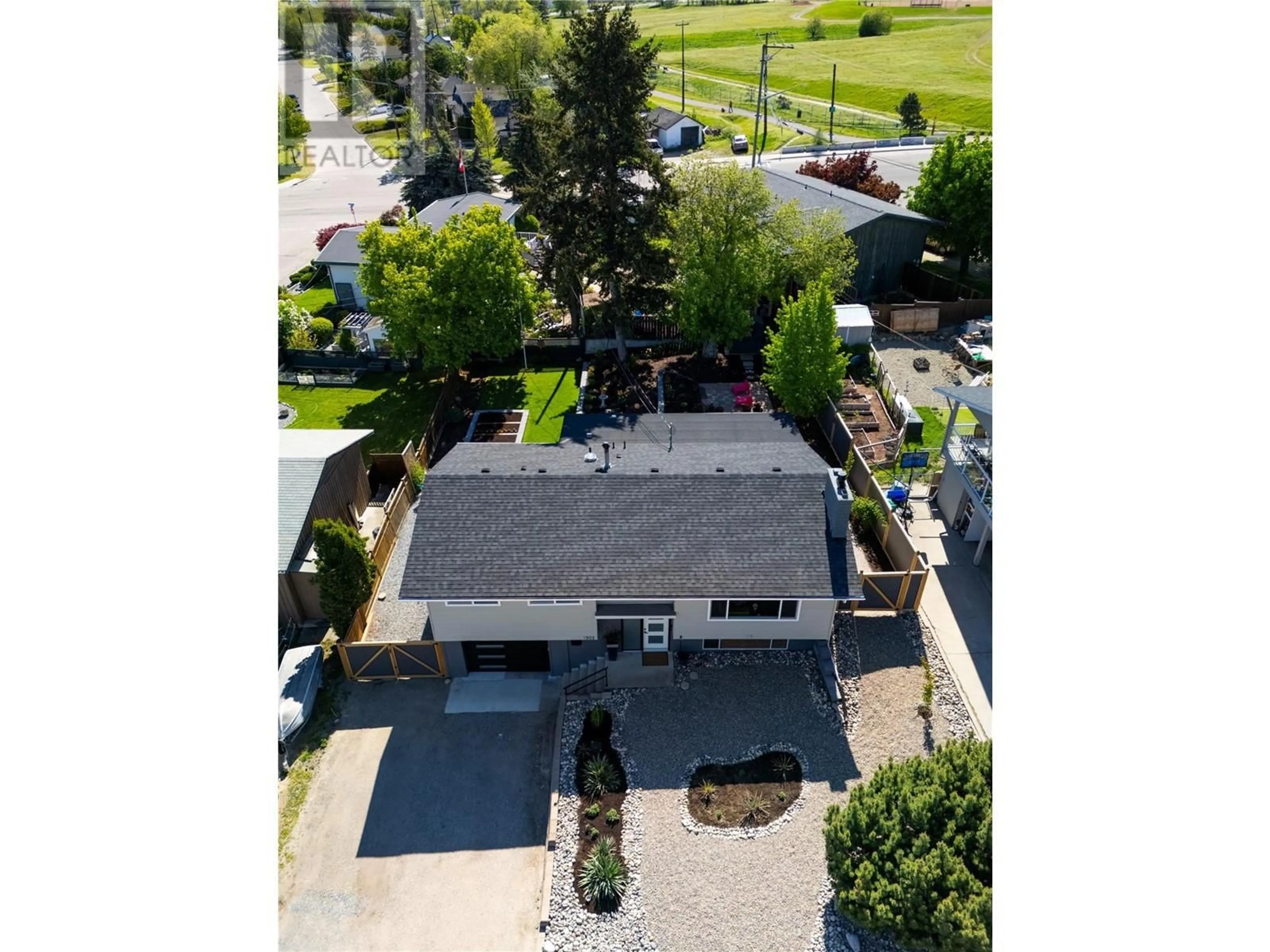 A pic from outside/outdoor area/front of a property/back of a property/a pic from drone, street for 1503 34A STREET, Vernon British Columbia V1T5Z6