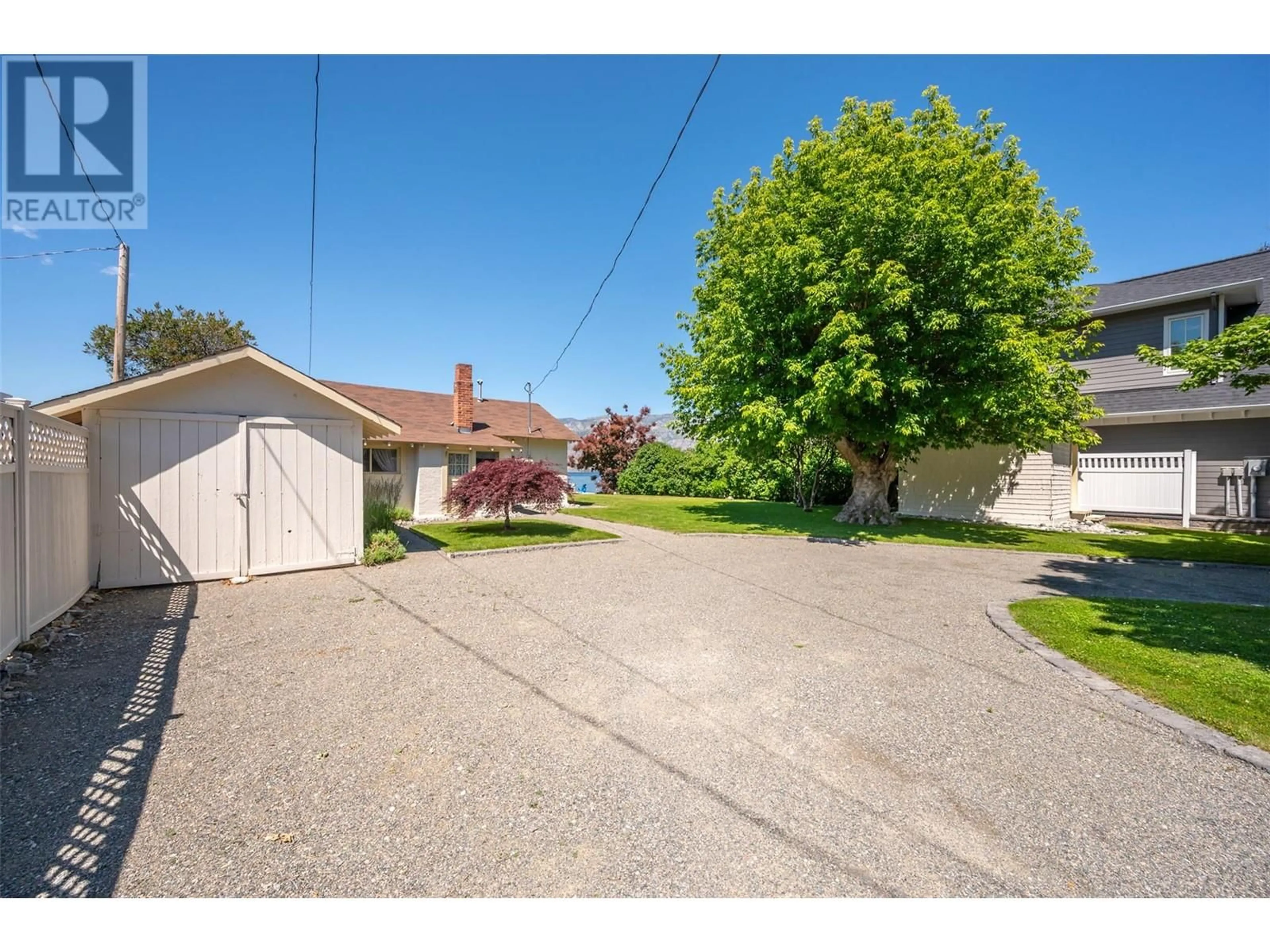 A pic from outside/outdoor area/front of a property/back of a property/a pic from drone, street for 19235 LAKESHORE DRIVE NORTH, Summerland British Columbia V0H1Z6