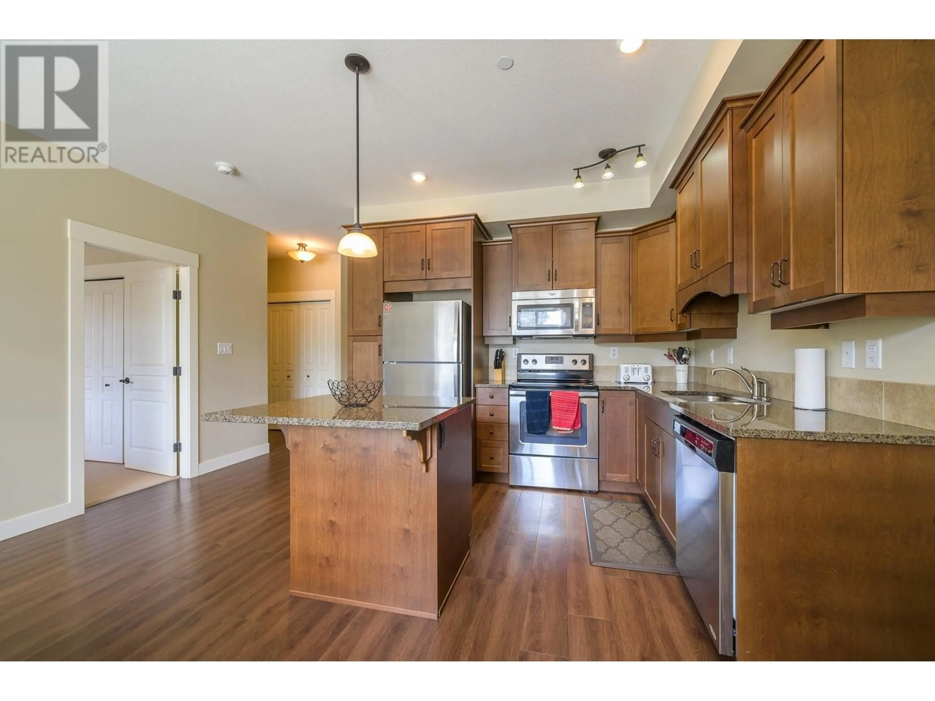 Open concept kitchen, wood/laminate floor for 302 - 755 MCGILL ROAD, Kamloops British Columbia V2C0B6