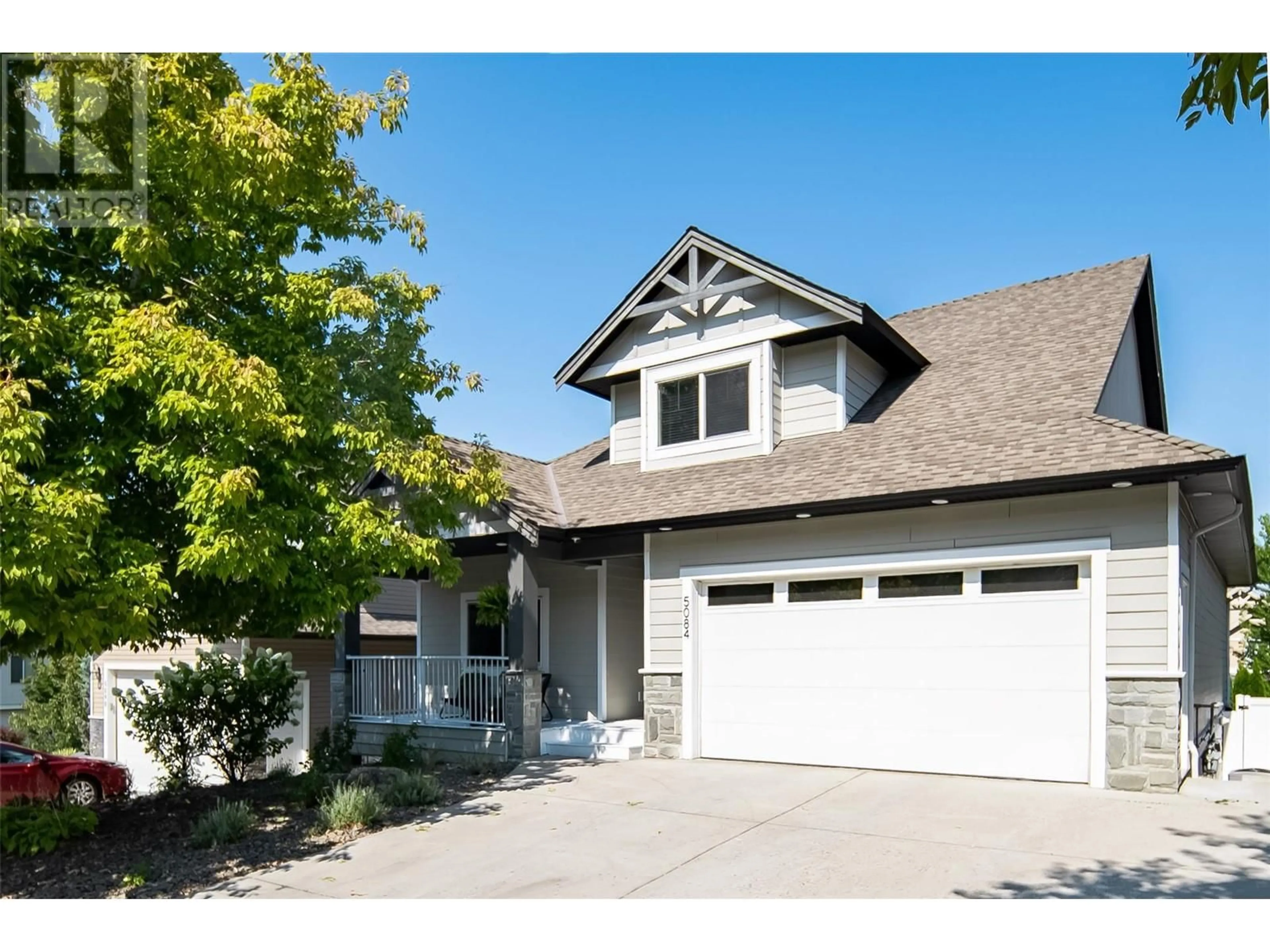 Home with vinyl exterior material, street for 5084 SEON CRESCENT, Kelowna British Columbia V1W5G8